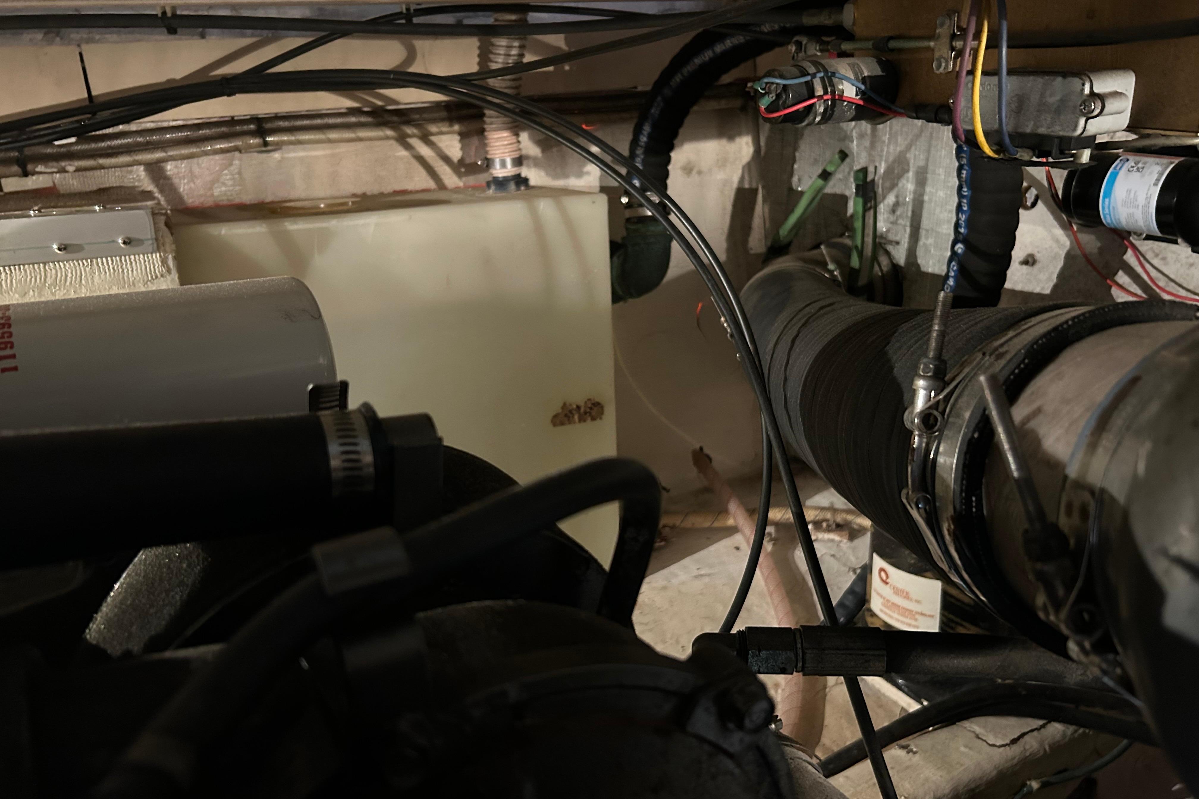Engine room of a 2004 Sabre 36 FB boat with visible wiring and components.