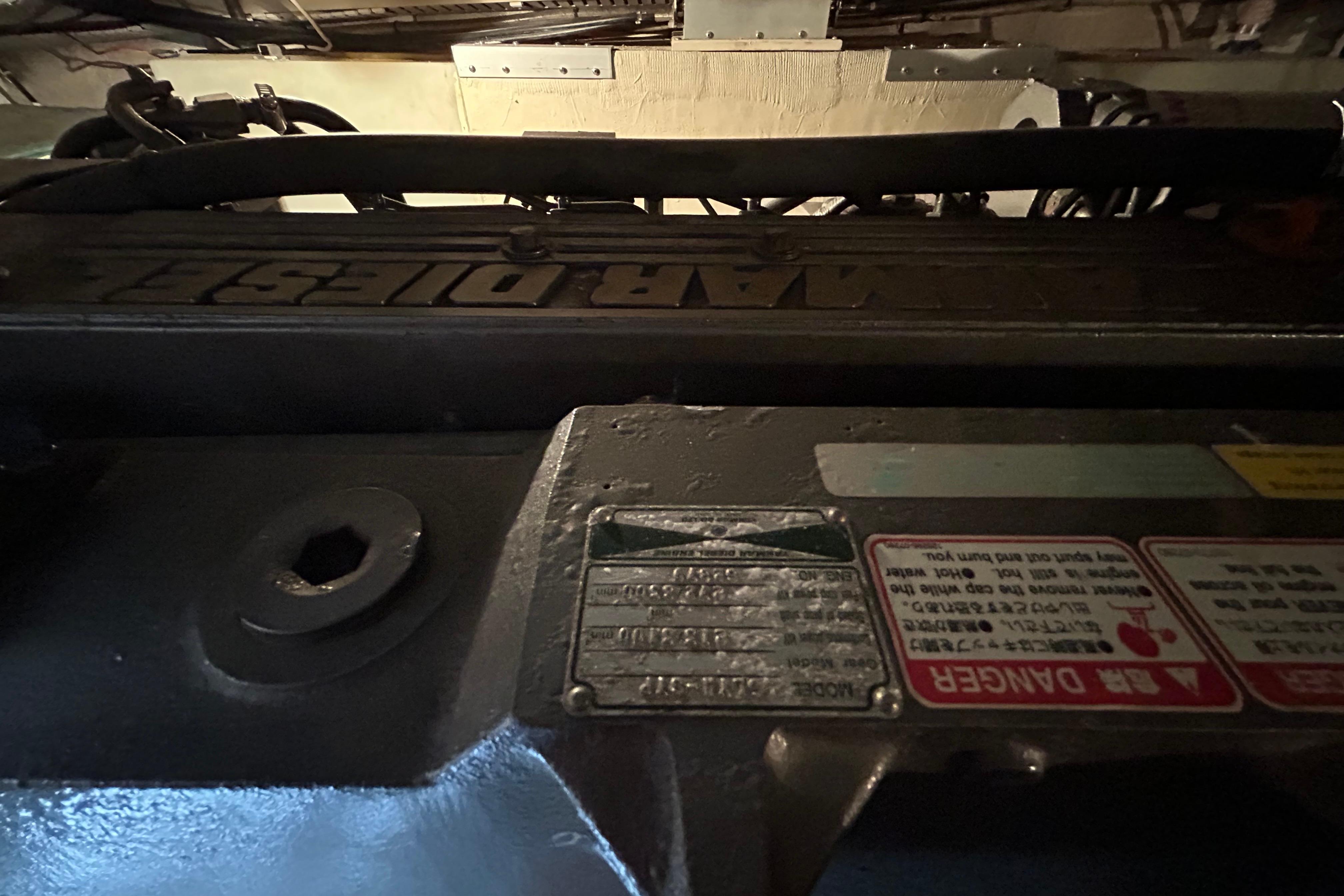 Engine compartment of a 2004 Sabre 36 FB boat, featuring a marine diesel engine.