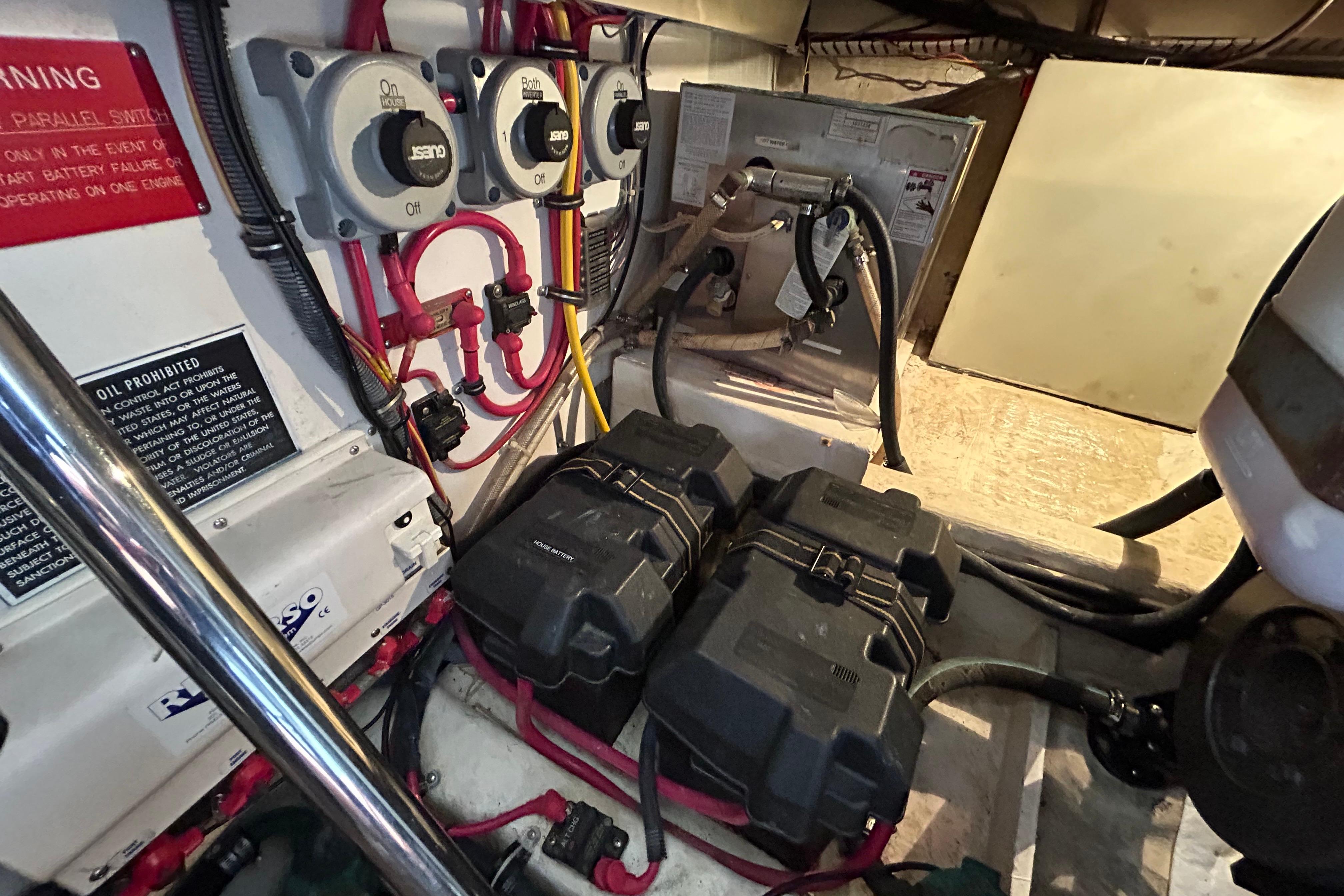 Engine room of 2004 Sabre 36 FB boat with wiring and battery setup.