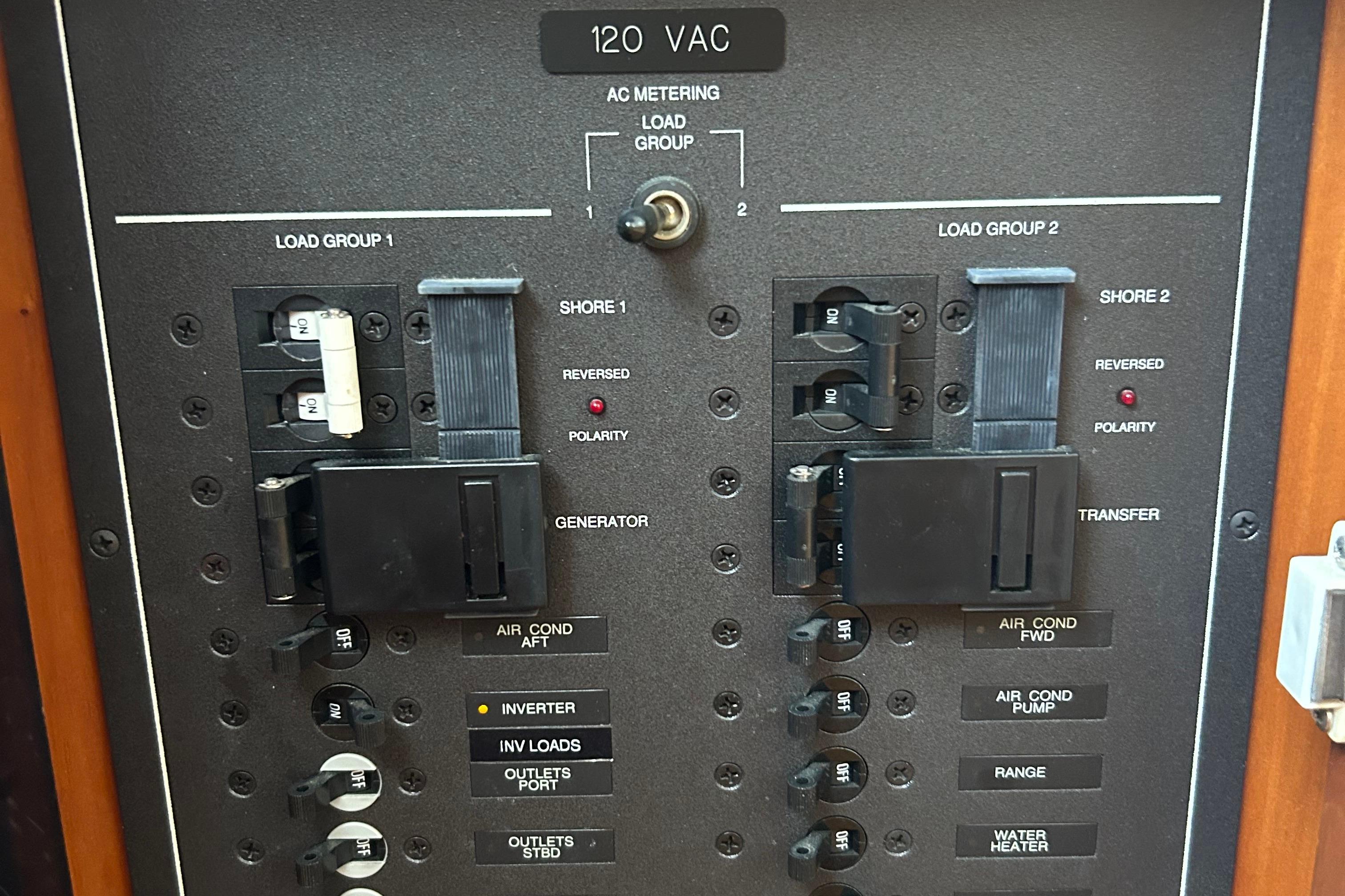 Electrical panel of a 2004 Sabre 36 FB boat, showing circuit breakers and switches.