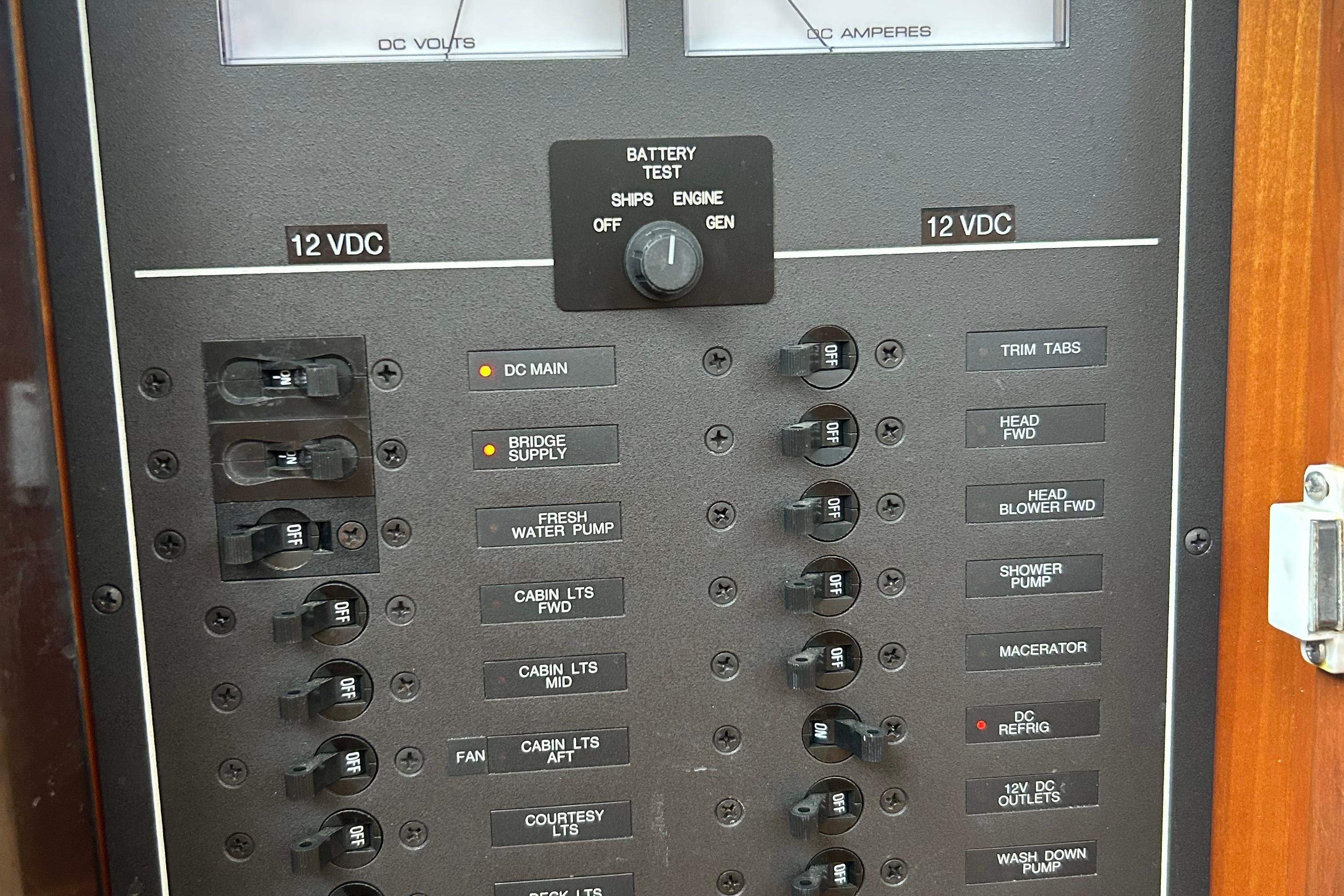 Electrical panel of a 2004 Sabre 36 FB boat, showing 12 VDC switches and controls.