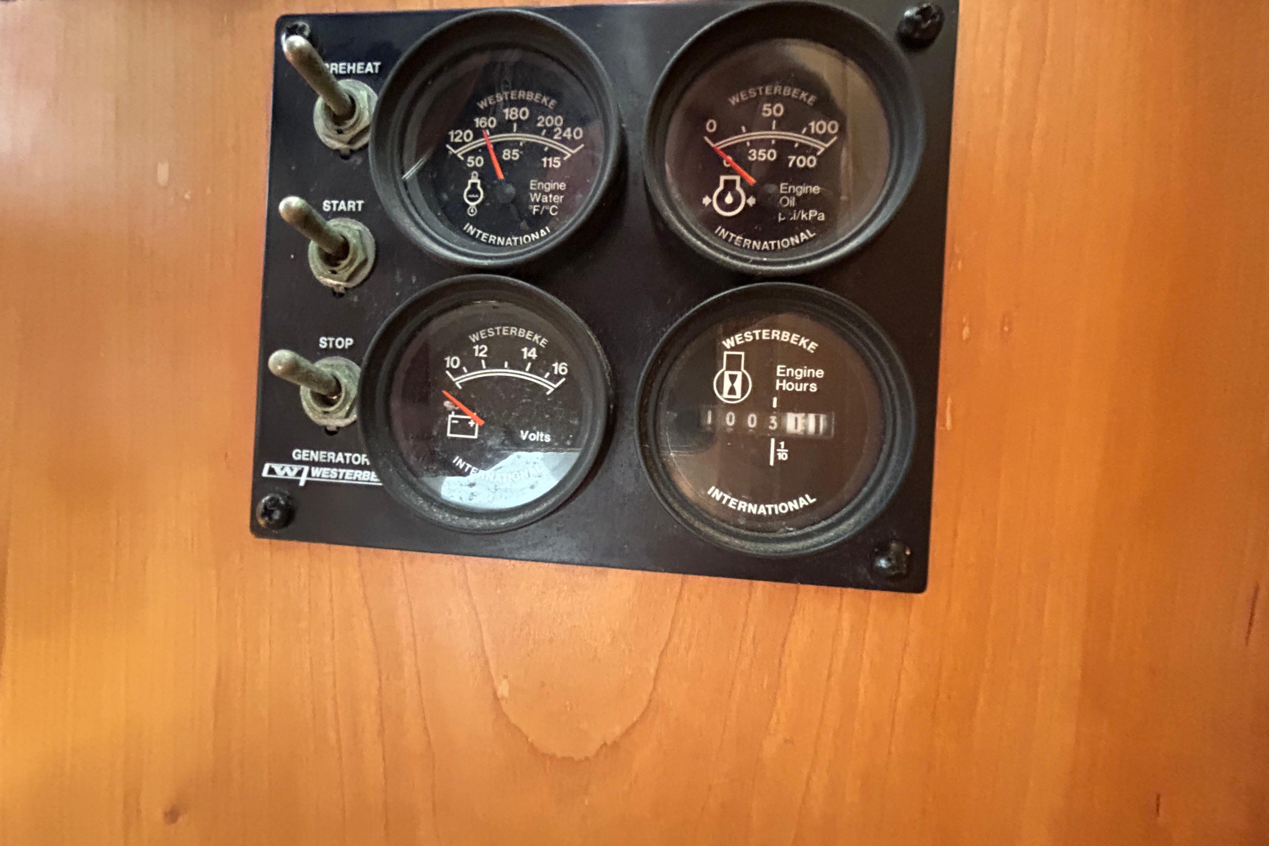 Control panel of a 2004 Sabre 36 FB with Westerbeke gauges and switches.