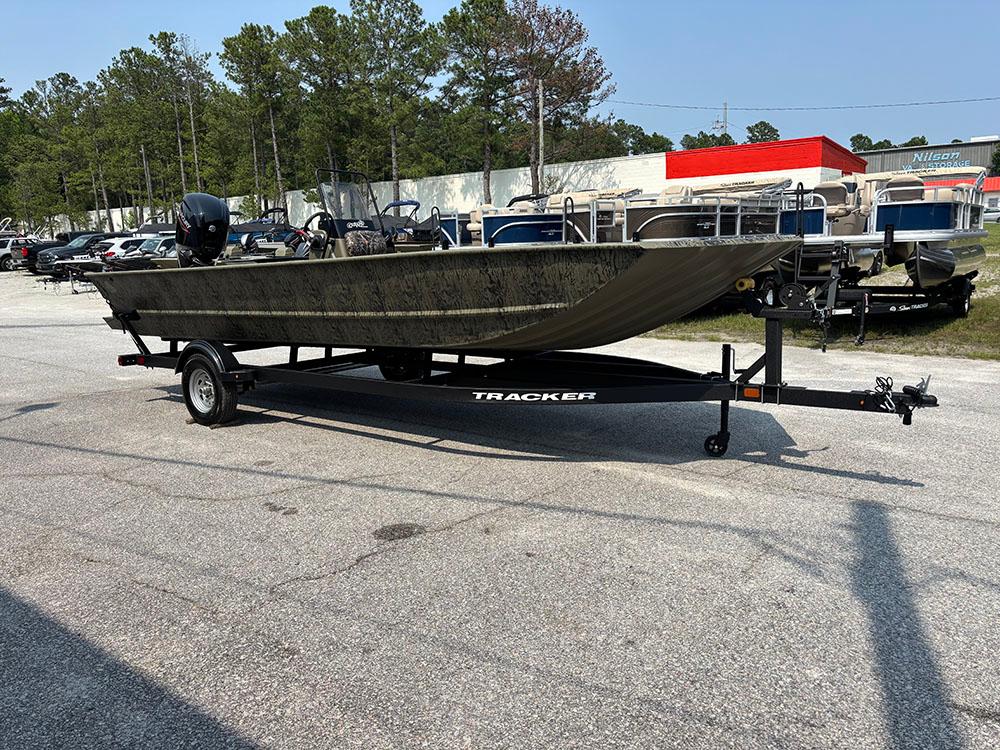 2025 Tracker Grizzly 2072 CC boat on trailer in outdoor lot.