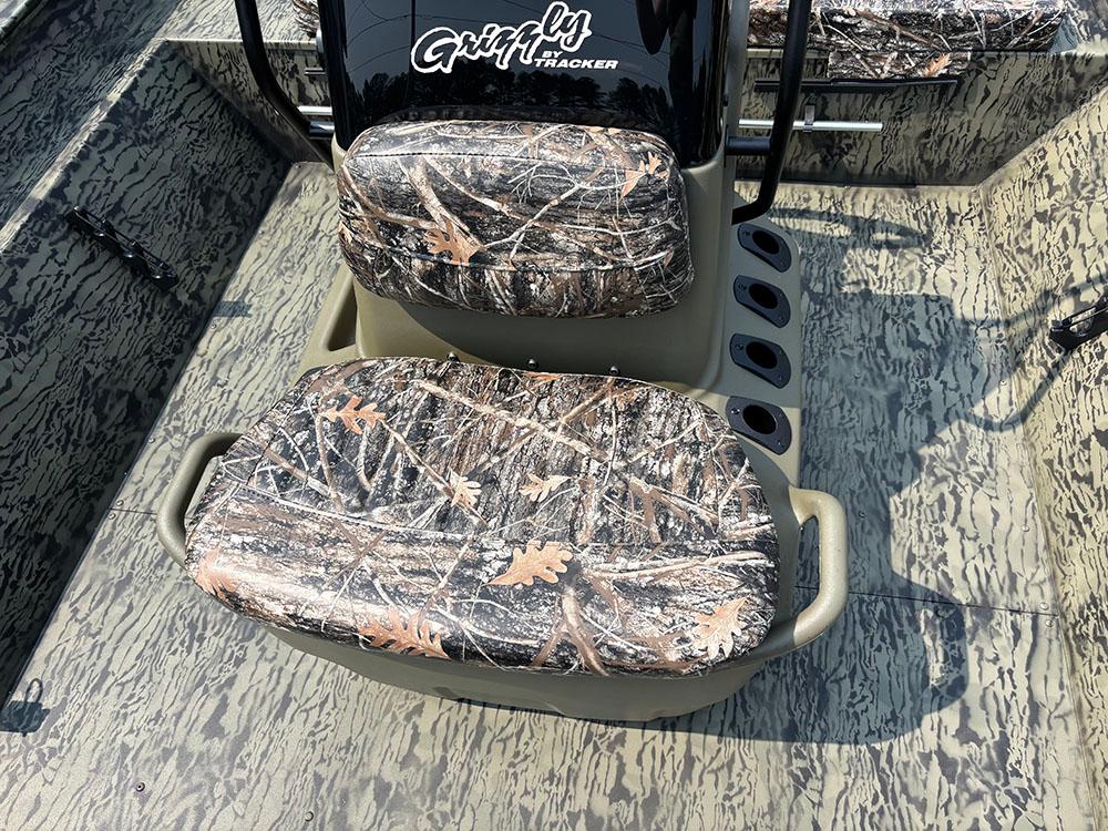 2025 Tracker Grizzly 2072 CC boat with camouflage seating and textured flooring.