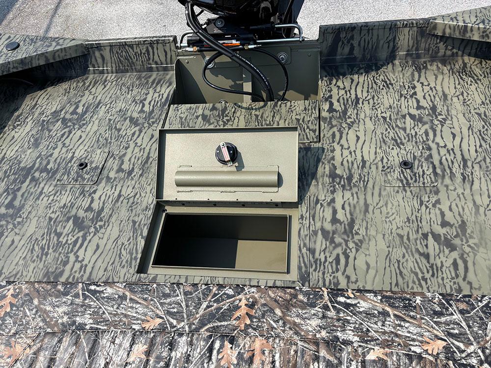 2025 Tracker Grizzly 2072 CC boat with open storage compartment, camo pattern design.