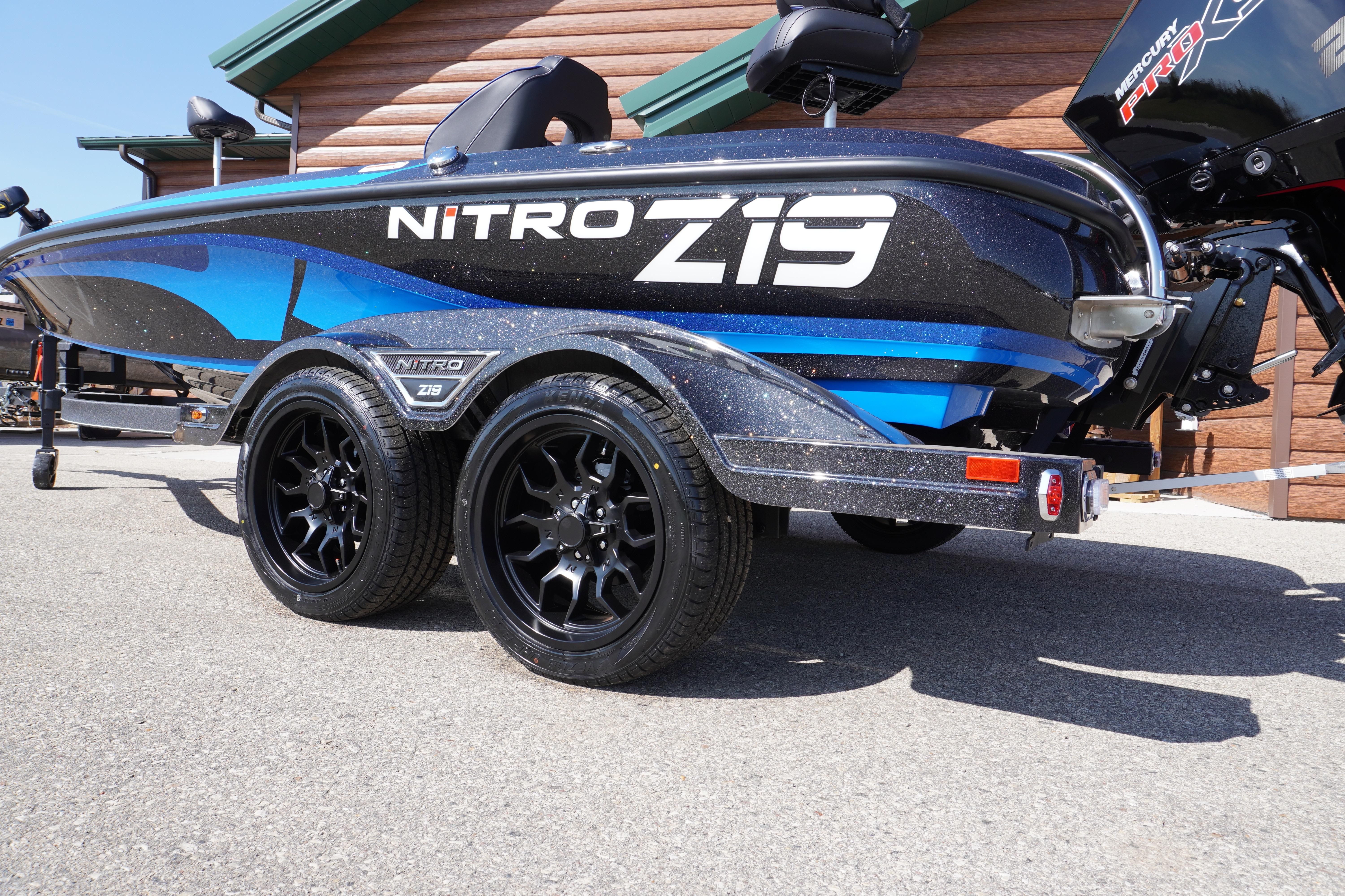 2024 Nitro Z19 boat on trailer, showcasing sleek design and dual black wheels.