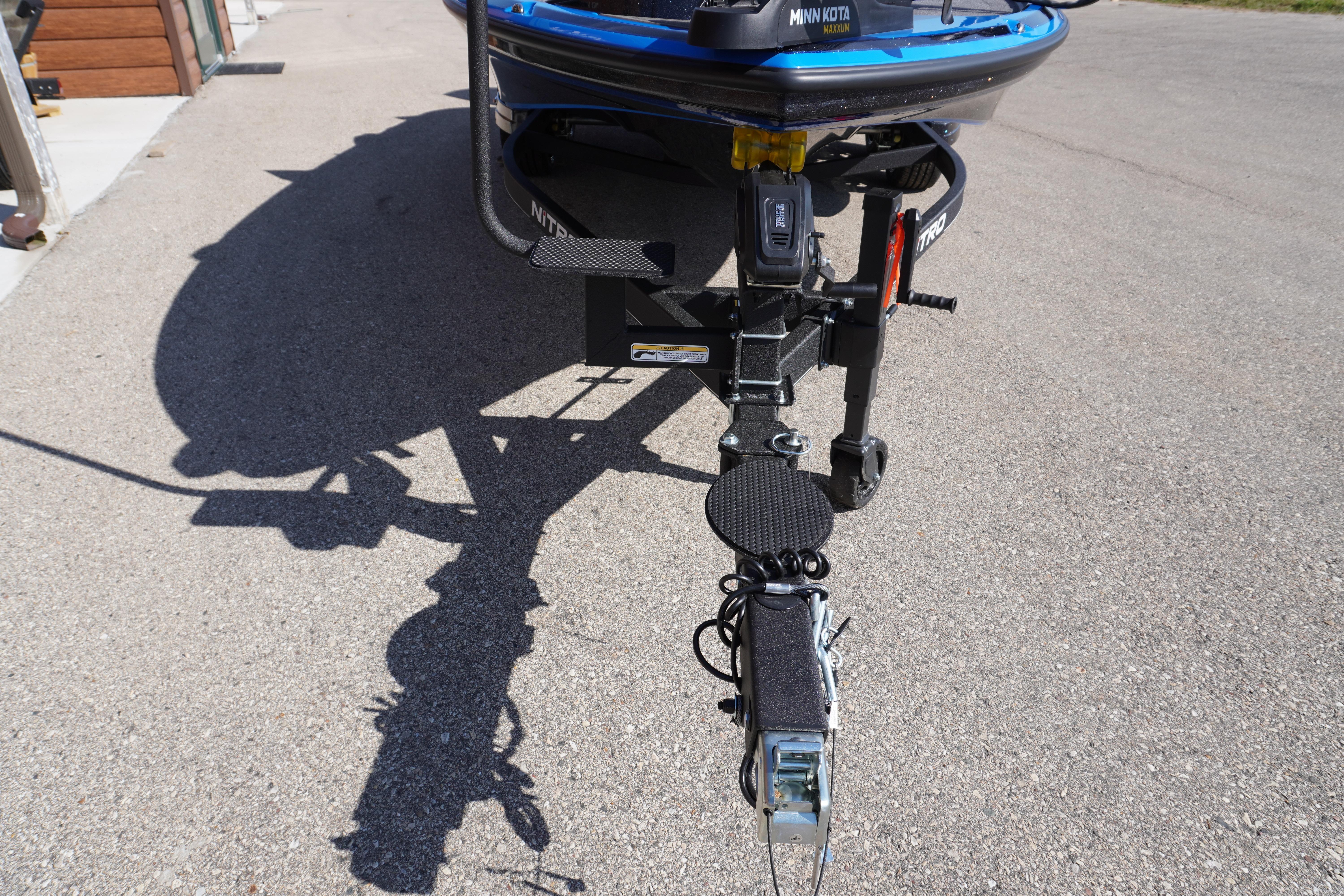 2024 Nitro Z19 boat trailer hitch on pavement, featuring Minn Kota trolling motor.