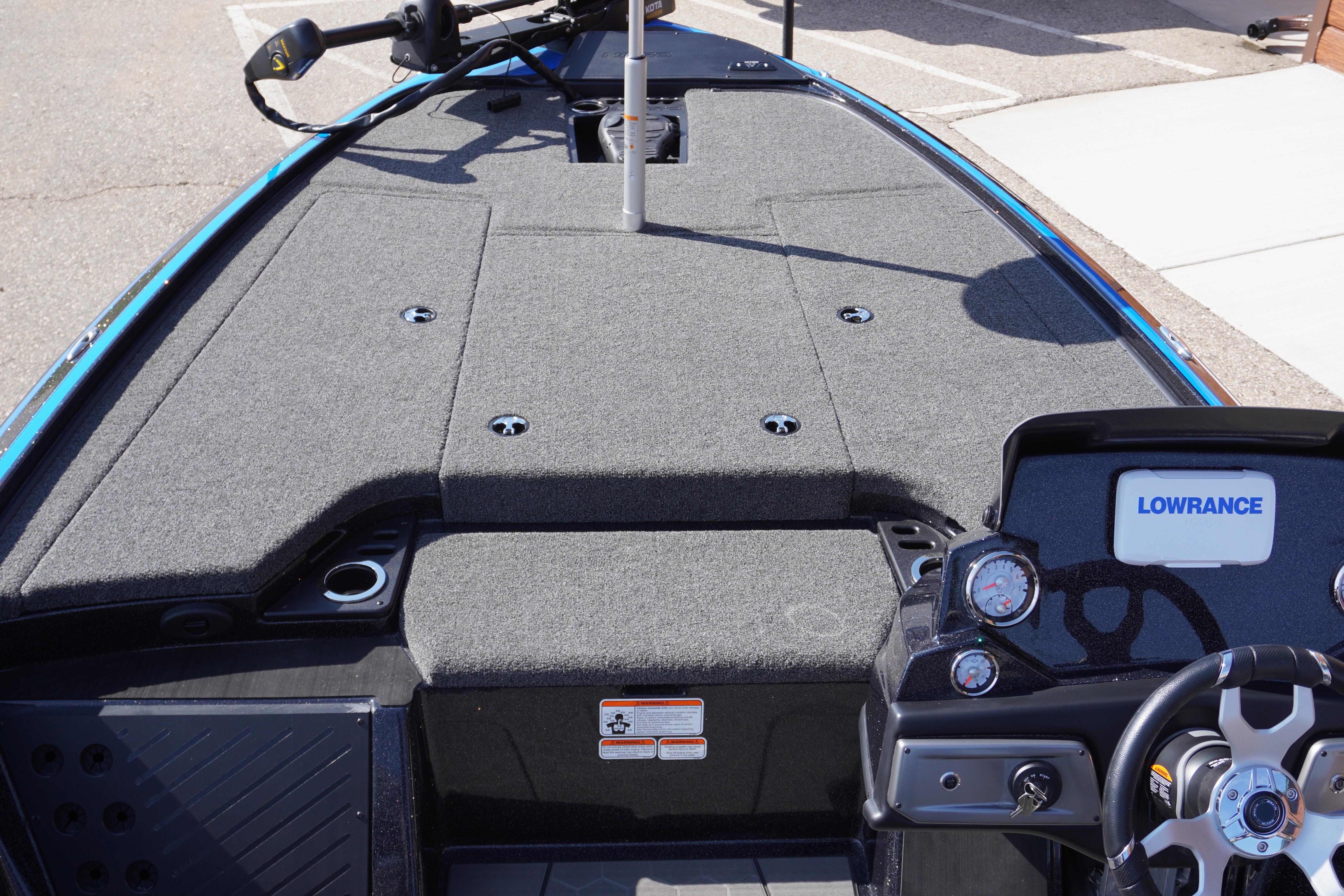 2024 Nitro Z19 boat interior with Lowrance system and steering wheel, featuring gray carpeted deck.