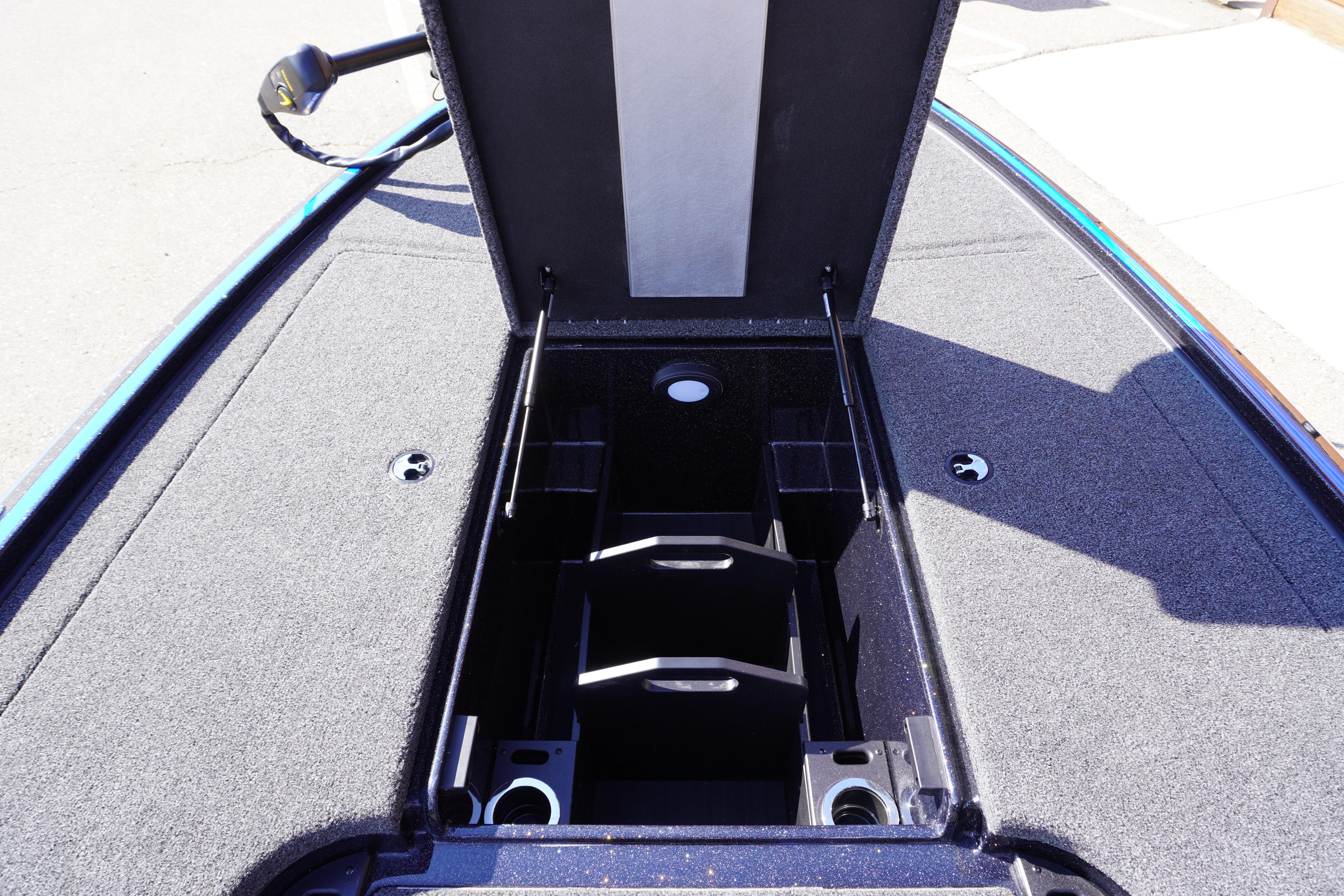 2024 Nitro Z19 boat storage compartment with open lid, showcasing interior design and features.