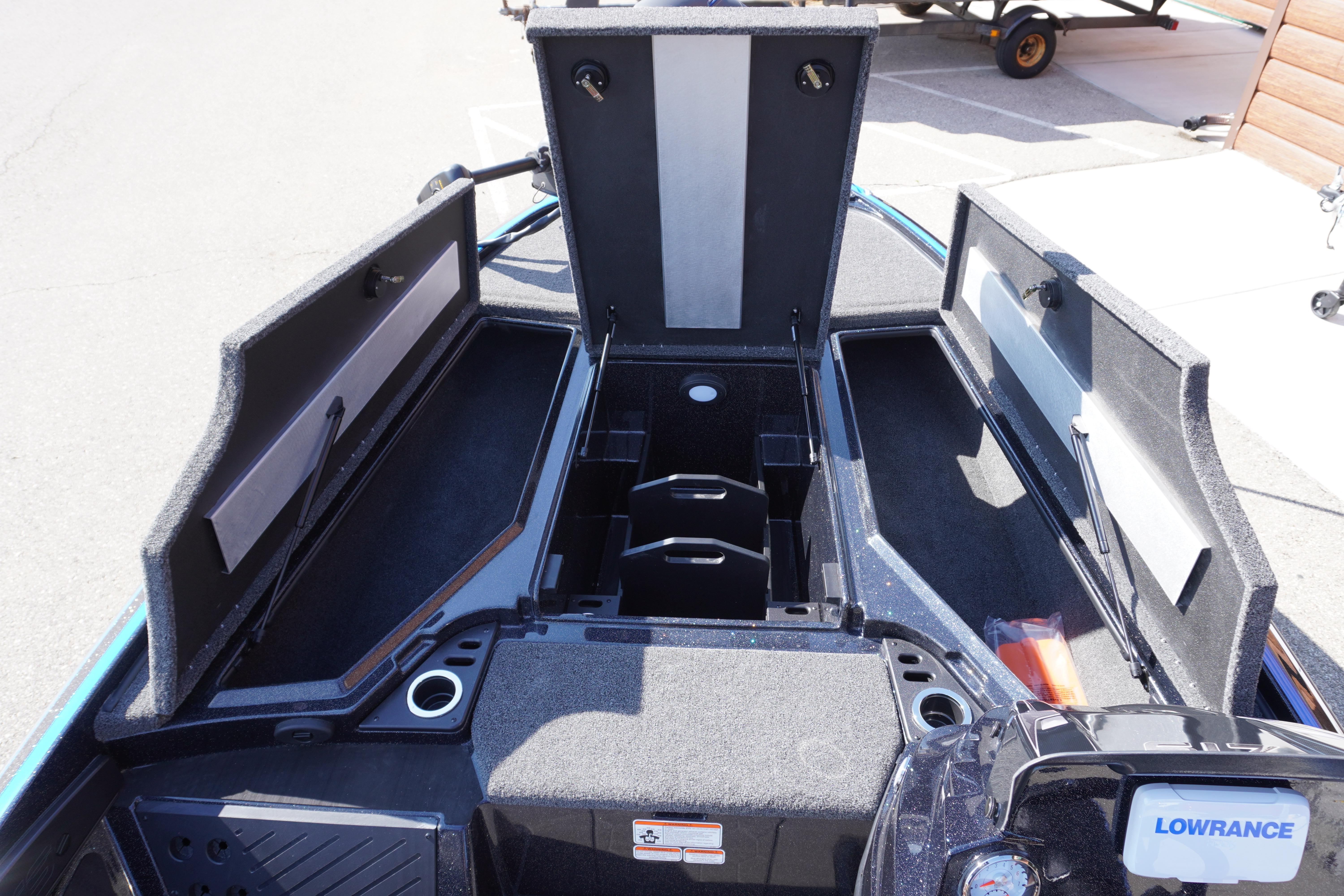 2024 Nitro Z19 boat storage compartments with open lids and Lowrance equipment.