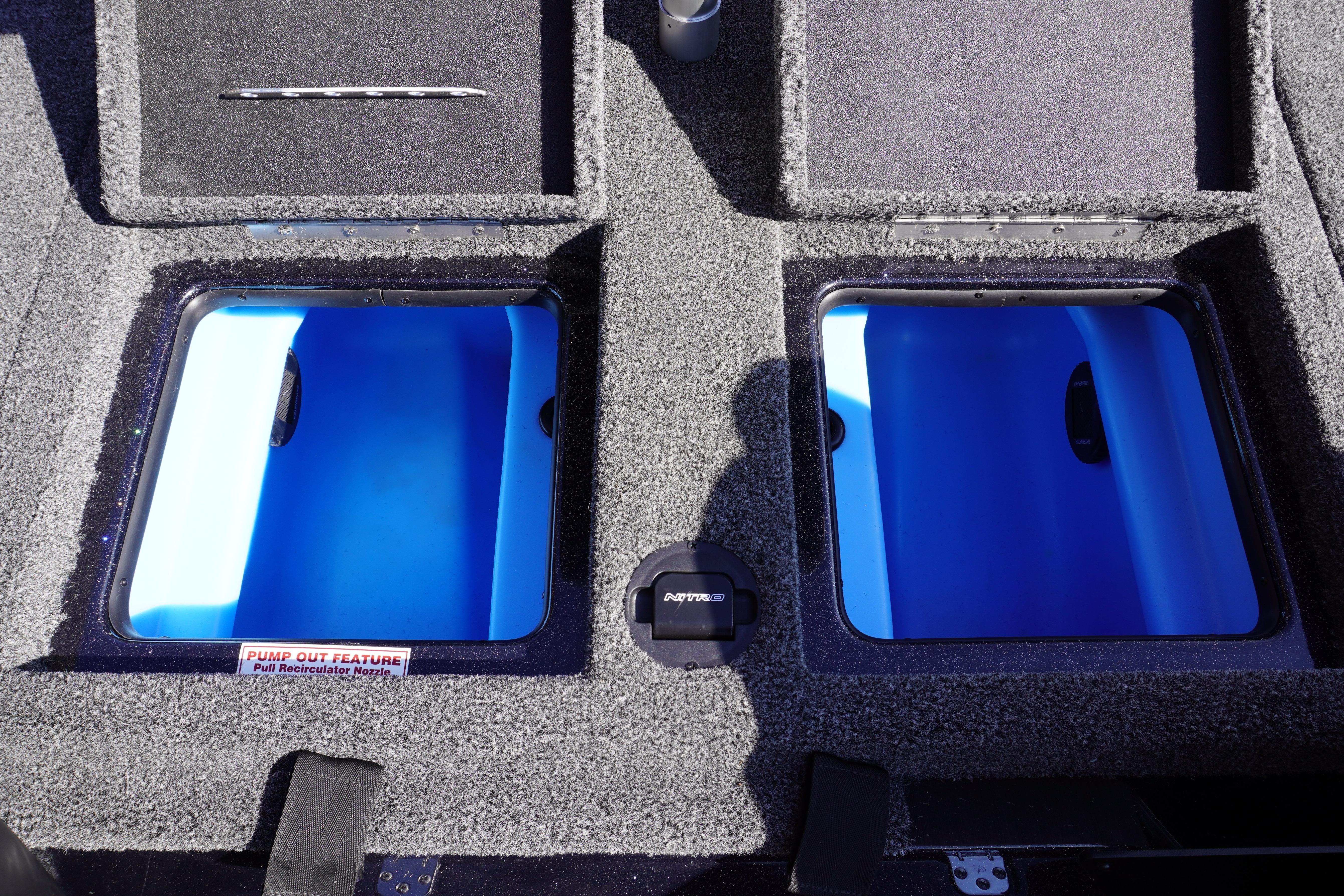 2024 Nitro Z19 boat storage compartments with blue interiors and pump-out feature.