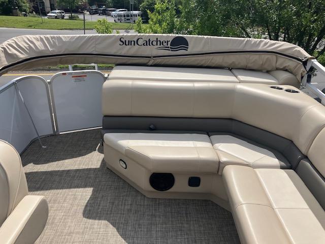 2020 G3 SunCatcher V322FC pontoon boat with beige seating and canopy.