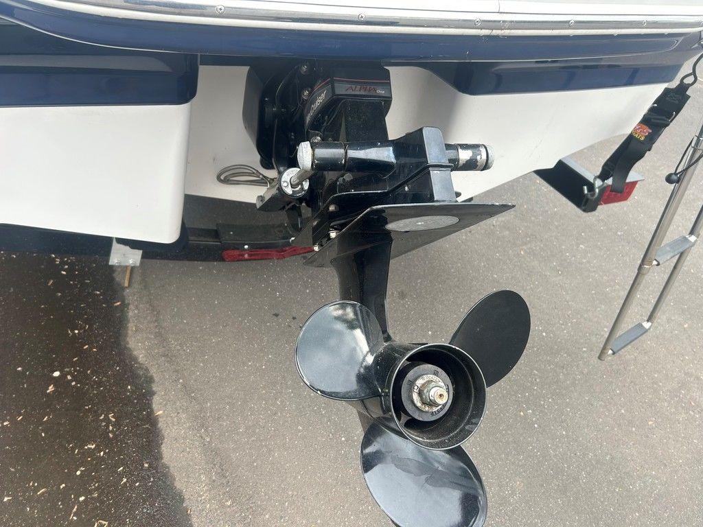 Rear view of 2017 Chaparral 21 H2O Sport boat showing propeller and ladder.
