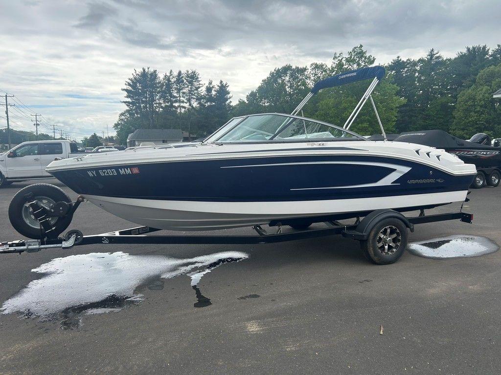 2017 Chaparral 21 H2O Sport boat on trailer, parked outdoors.