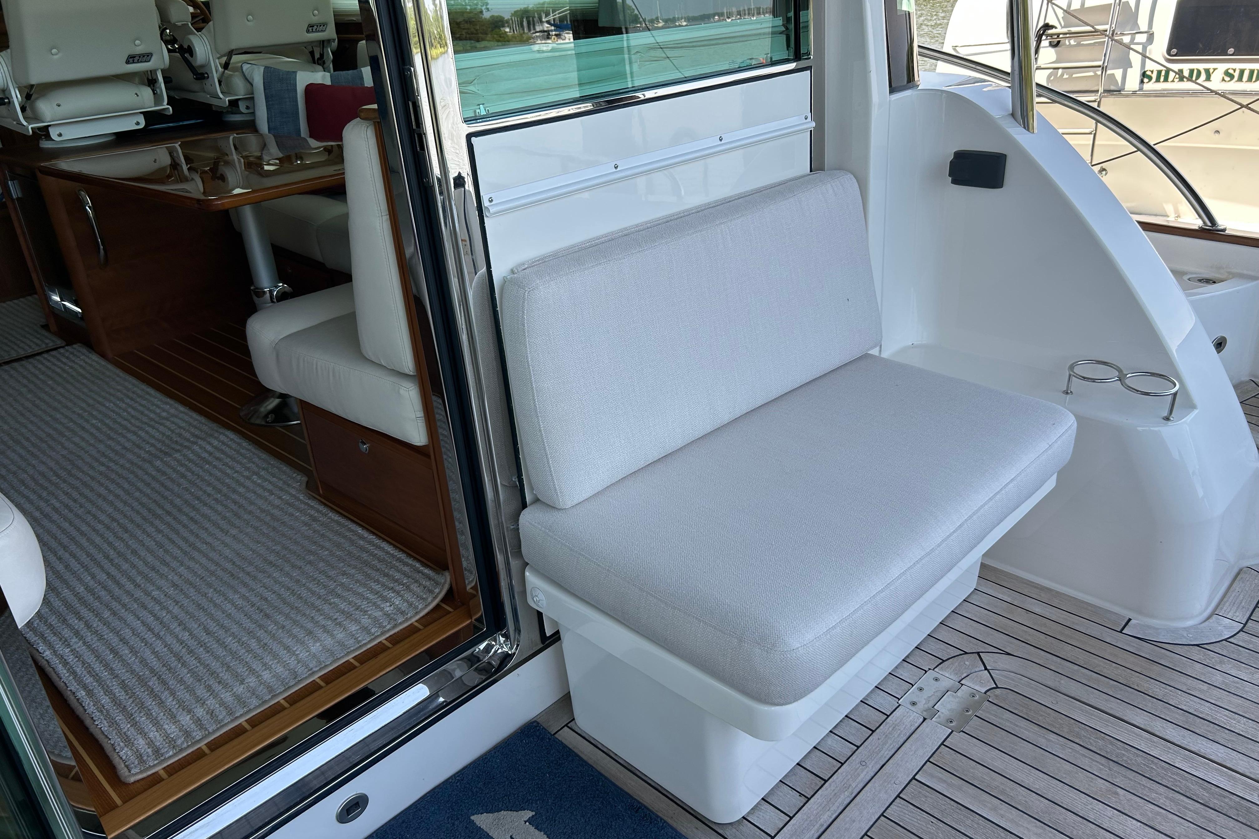 2022 Sabre 45 Salon Express interior with cushioned seating and wooden flooring.
