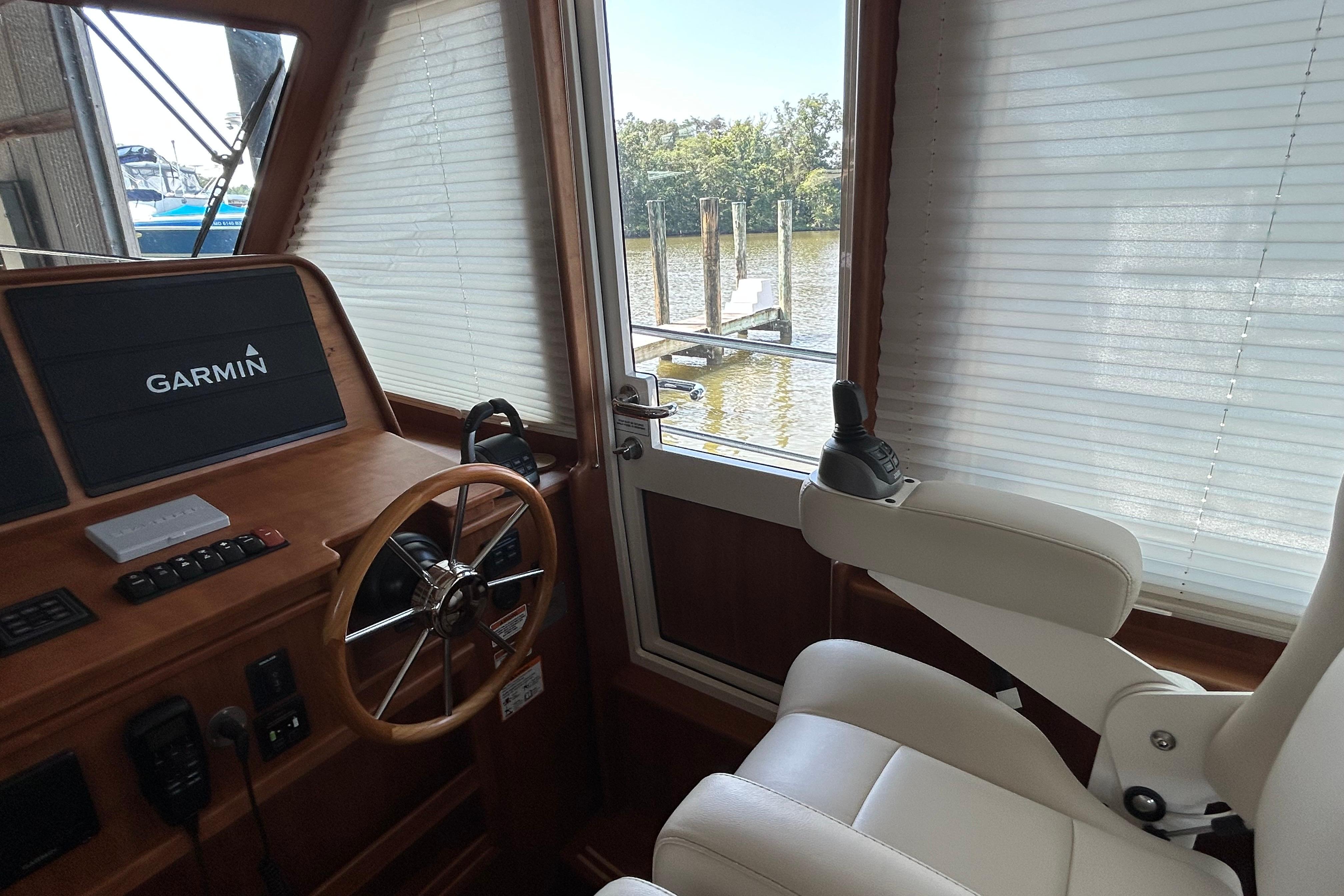 Interior helm of 2022 Sabre 45 Salon Express with Garmin navigation system.