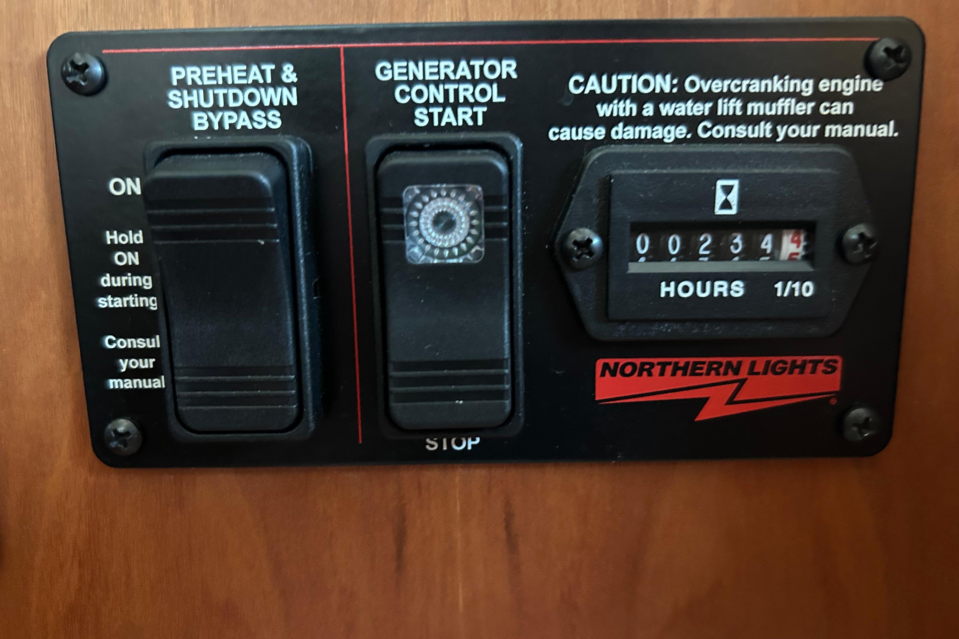 Control panel of a 2022 Sabre 45 Salon Express with generator hour meter and switches.
