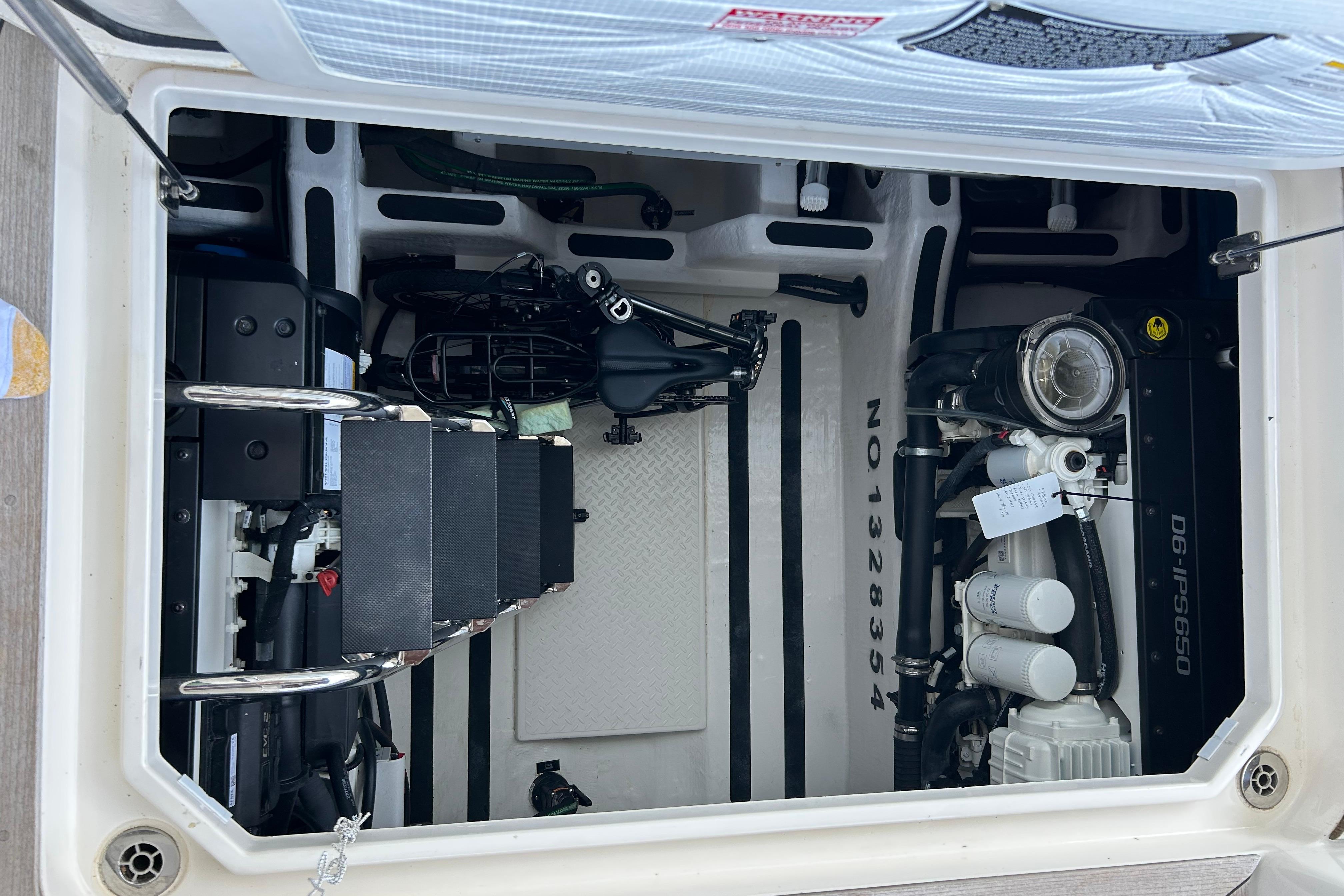 Engine compartment of 2022 Sabre 45 Salon Express, showcasing mechanical components and layout.