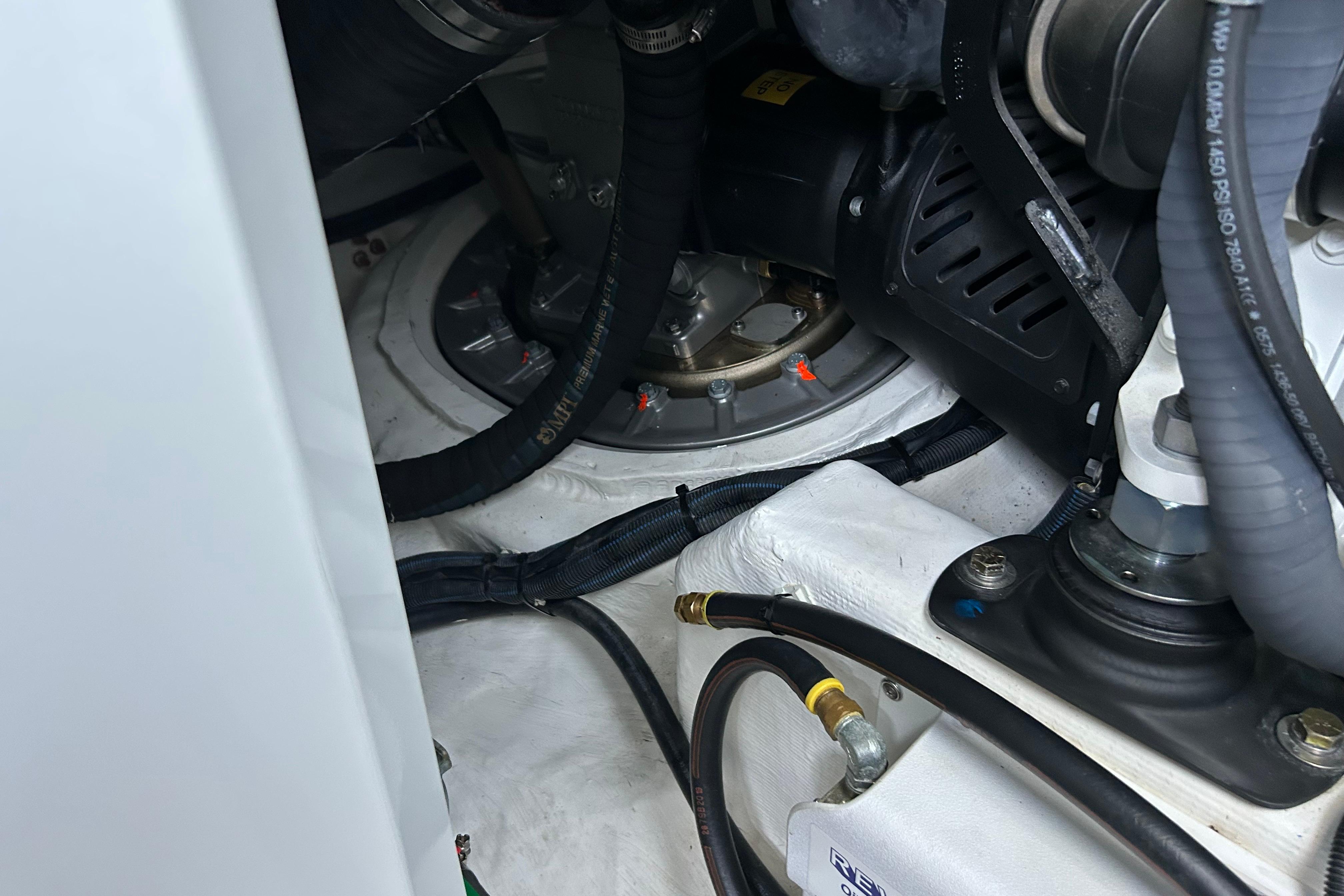 Engine compartment of 2022 Sabre 45 Salon Express with visible hoses and components.