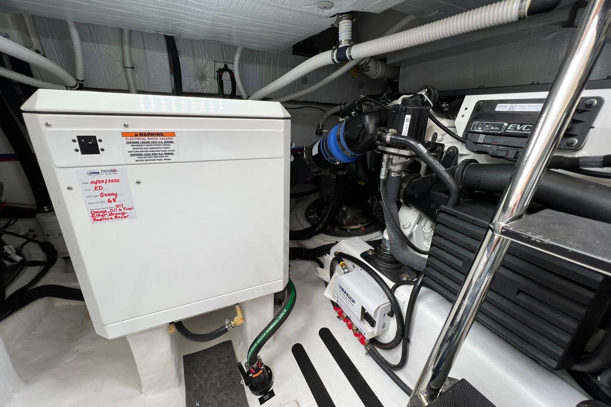 Engine room of 2022 Sabre 45 Salon Express, showcasing electrical and mechanical components.