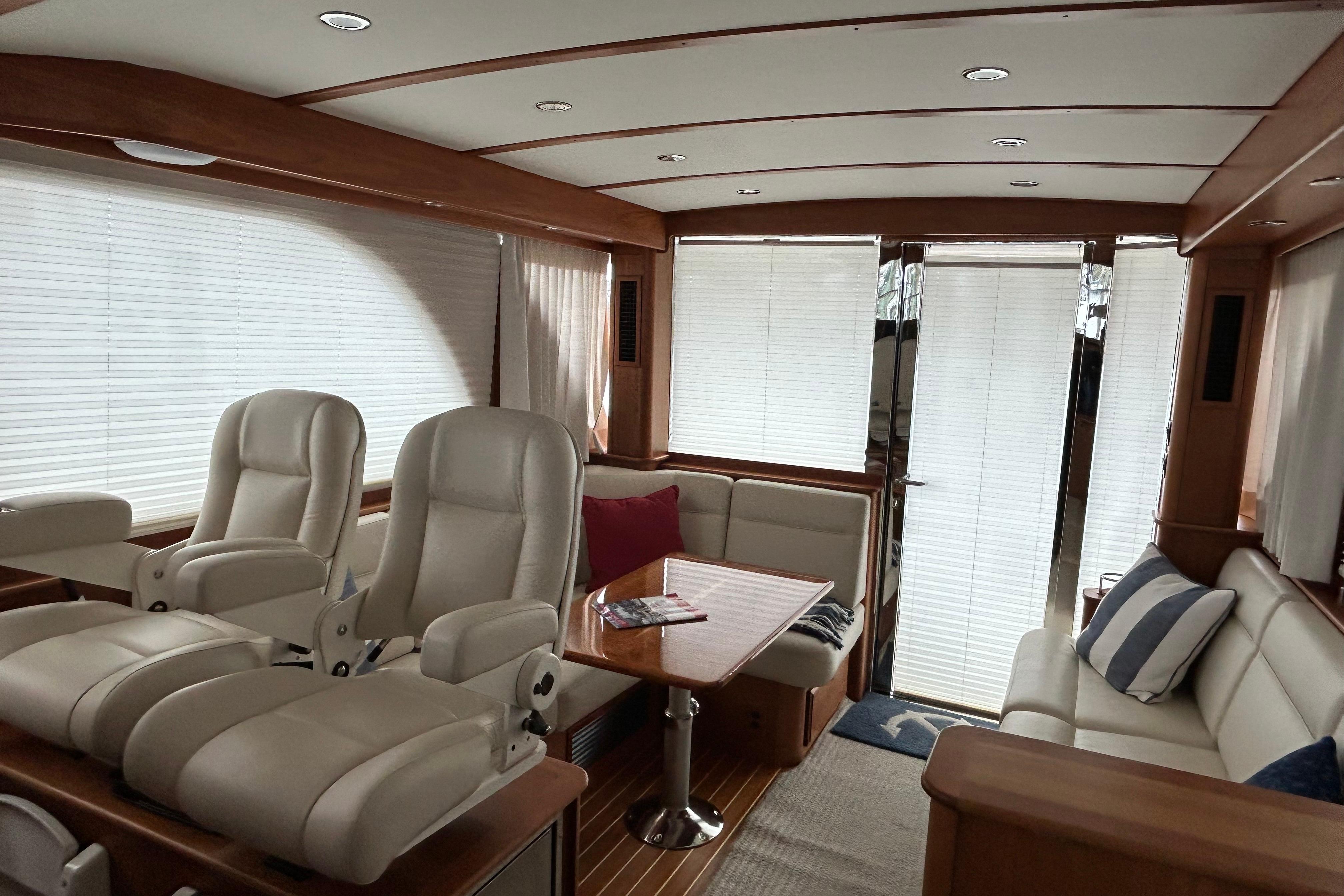 Luxurious interior of 2022 Sabre 45 Salon Express yacht with plush seating and elegant design.