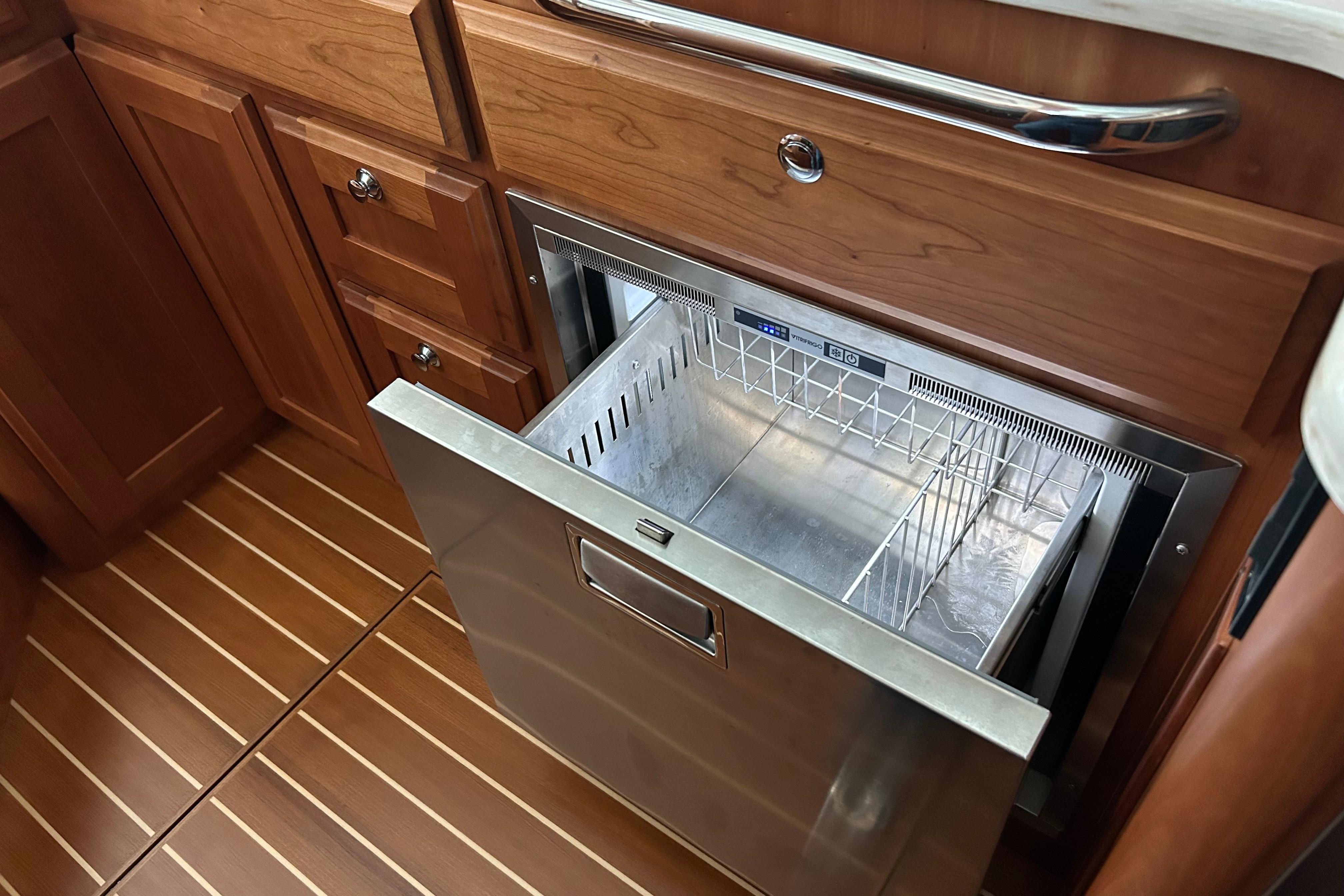 Open drawer refrigerator in 2022 Sabre 45 Salon Express yacht kitchen.