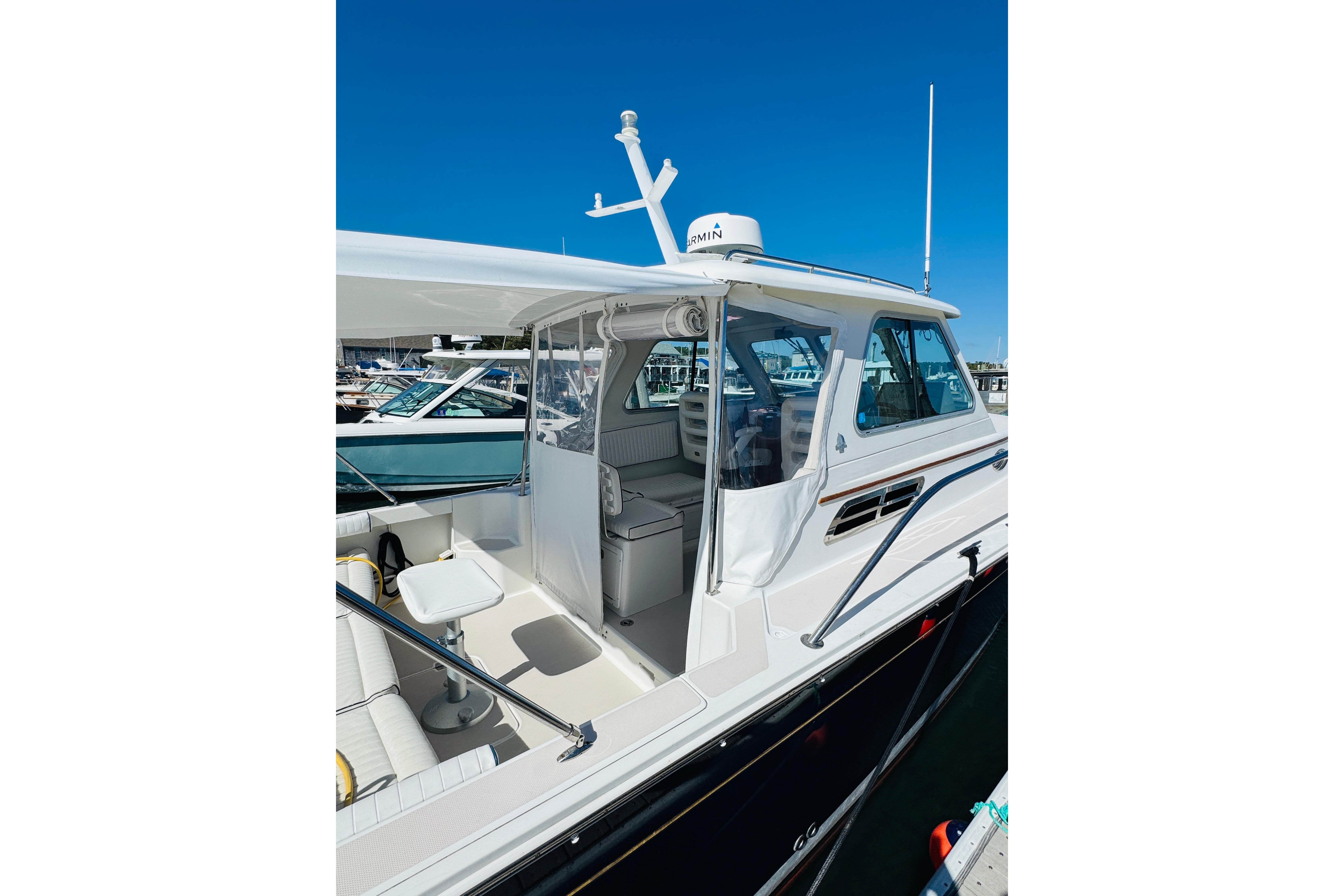 2007 Back Cove 29 boat docked, showcasing sleek design and spacious cockpit area.