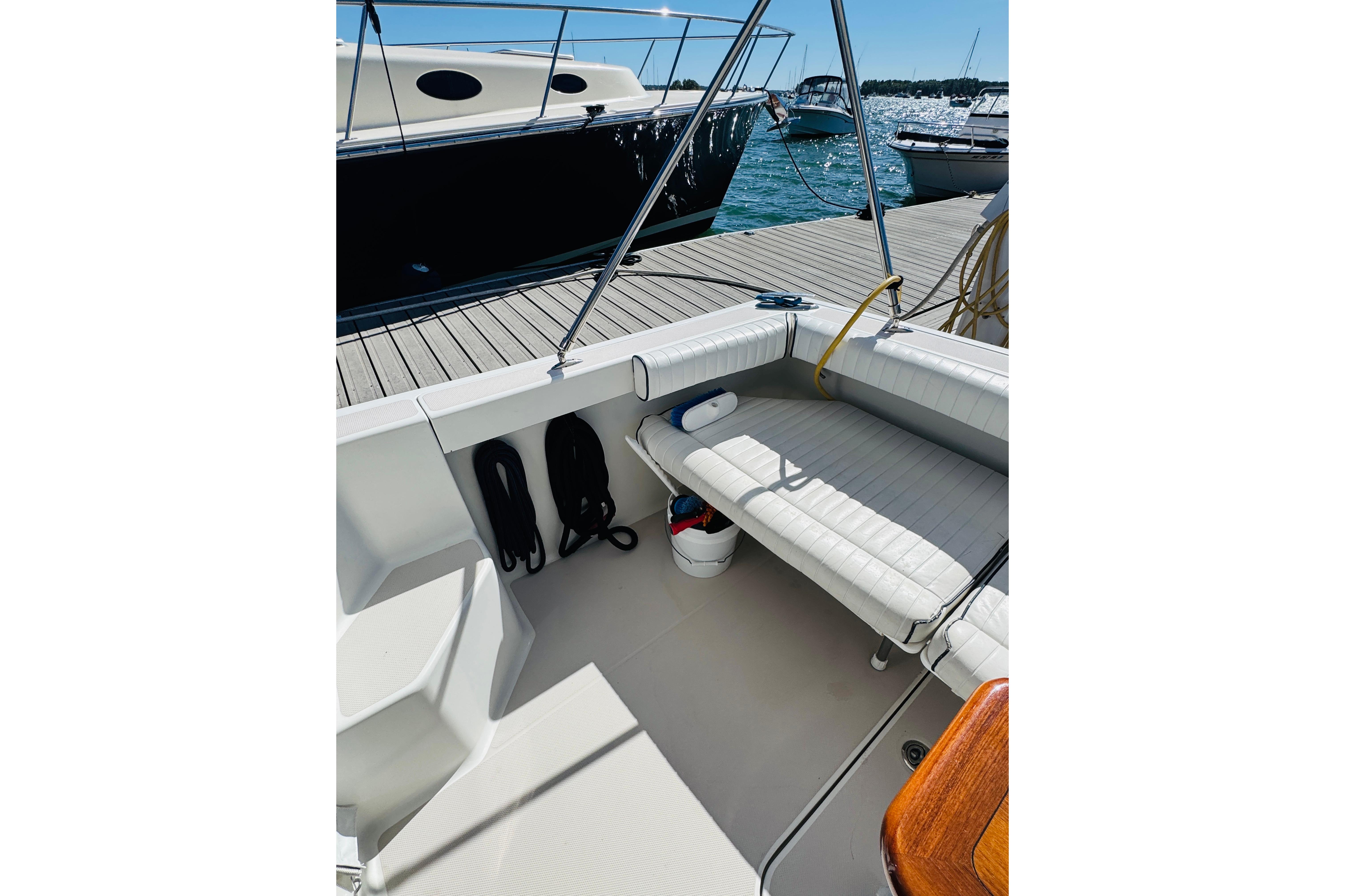 2007 Back Cove 29 boat interior with seating, docked by the water.