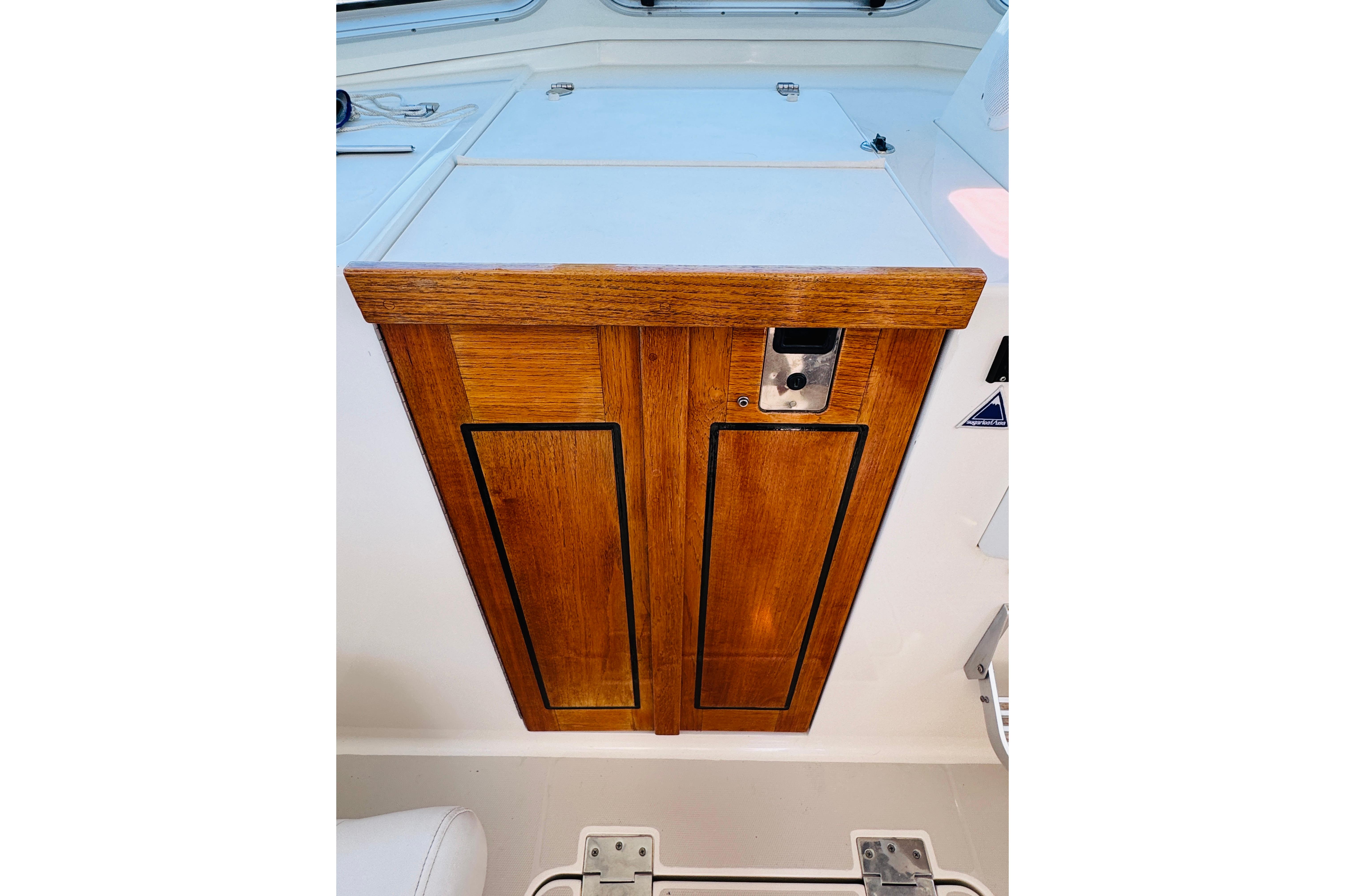 Wooden cabinet door on 2007 Back Cove 29 boat interior.