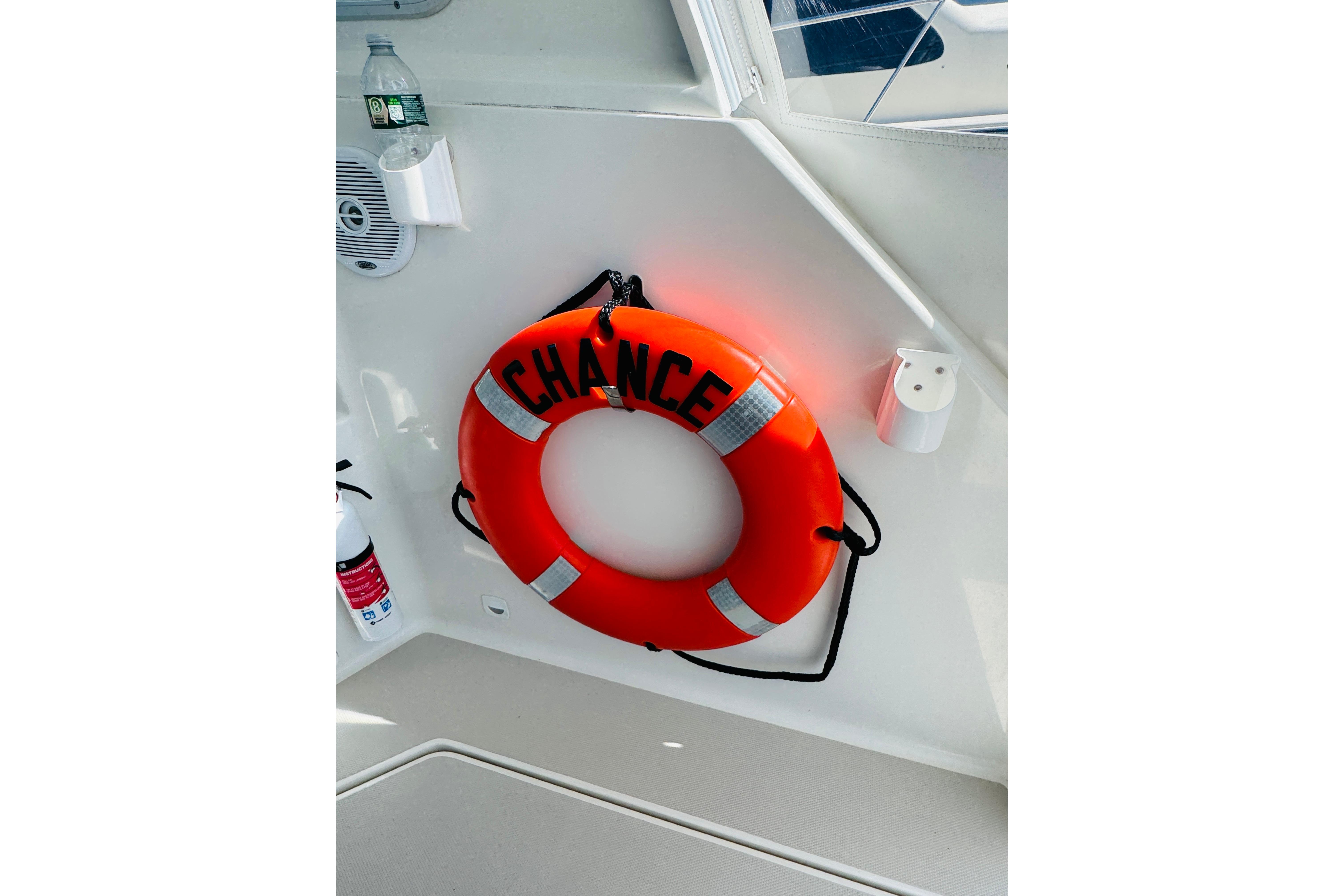 Orange life ring labeled u0022Chanceu0022 on 2007 Back Cove 29 boat interior.