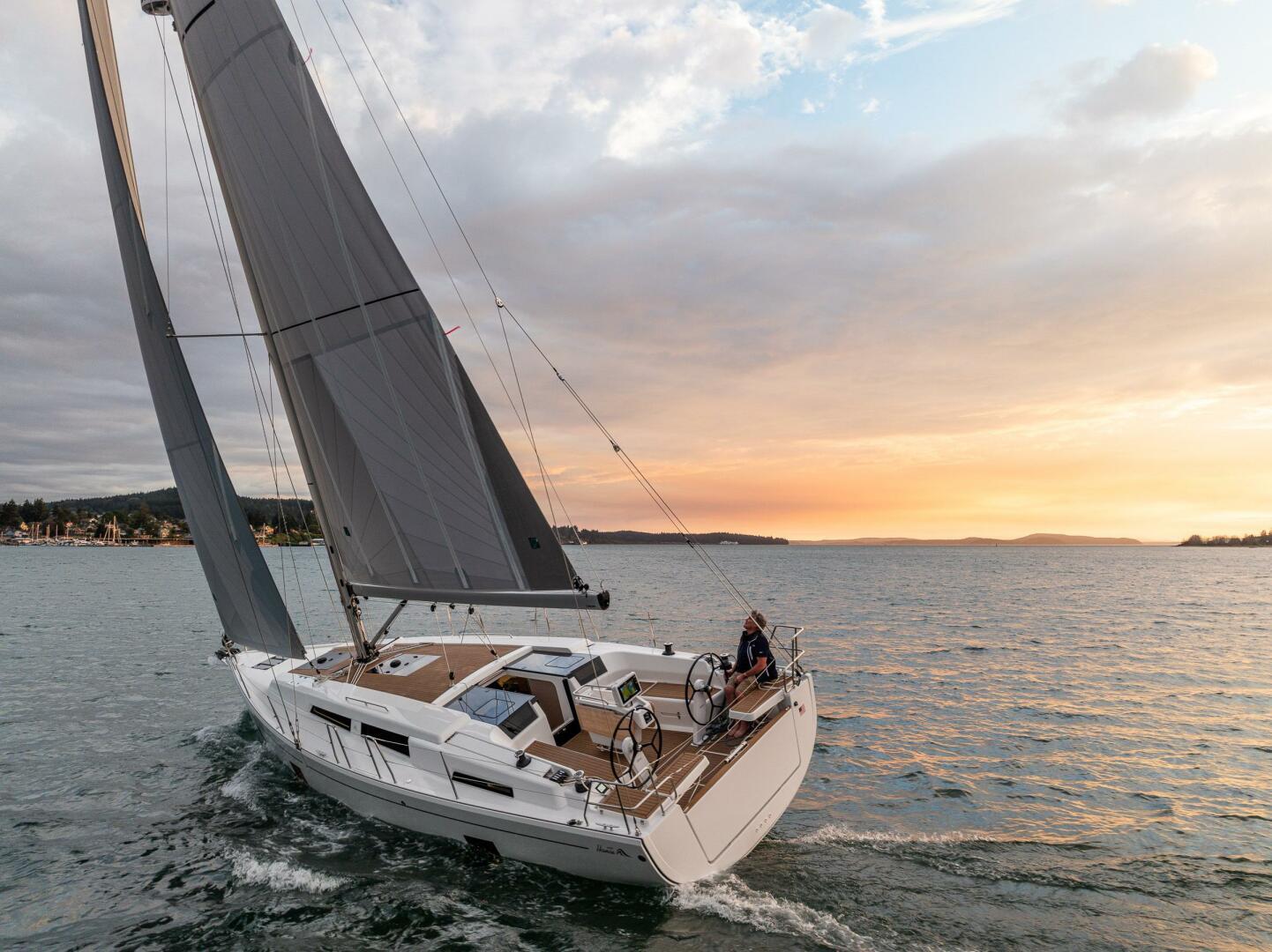 Hanse-418 2023-SEA #304 IN STOCK WA-US-Sailing yacht Hanse 418, 2023 model, cruising at sunset on open water.-9568627 | Thumbnail