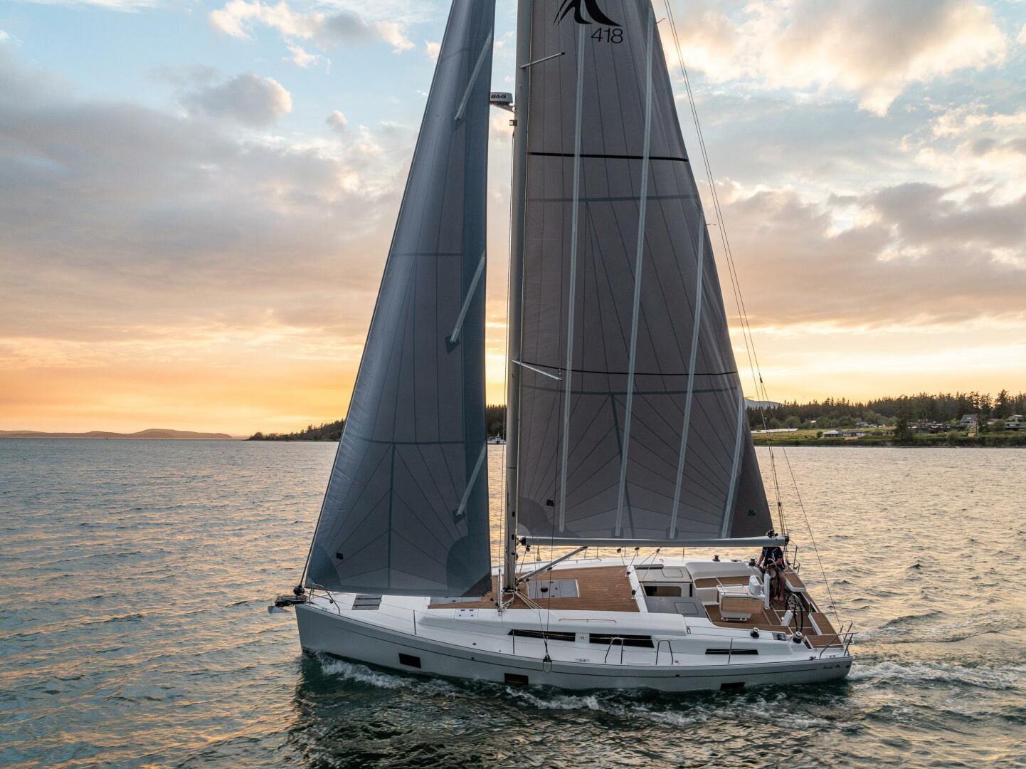 Hanse-418 2023-SEA #304 IN STOCK WA-US-Sailing yacht Hanse 418, 2023 model, cruising at sunset on open water.-9568627 | Thumbnail