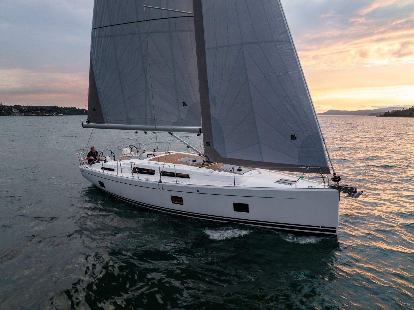 Hanse-418 2023-SEA #304 IN STOCK WA-US-2023 Hanse 418 sailboat cruising at sunset on open water.-9568627 | Thumbnail