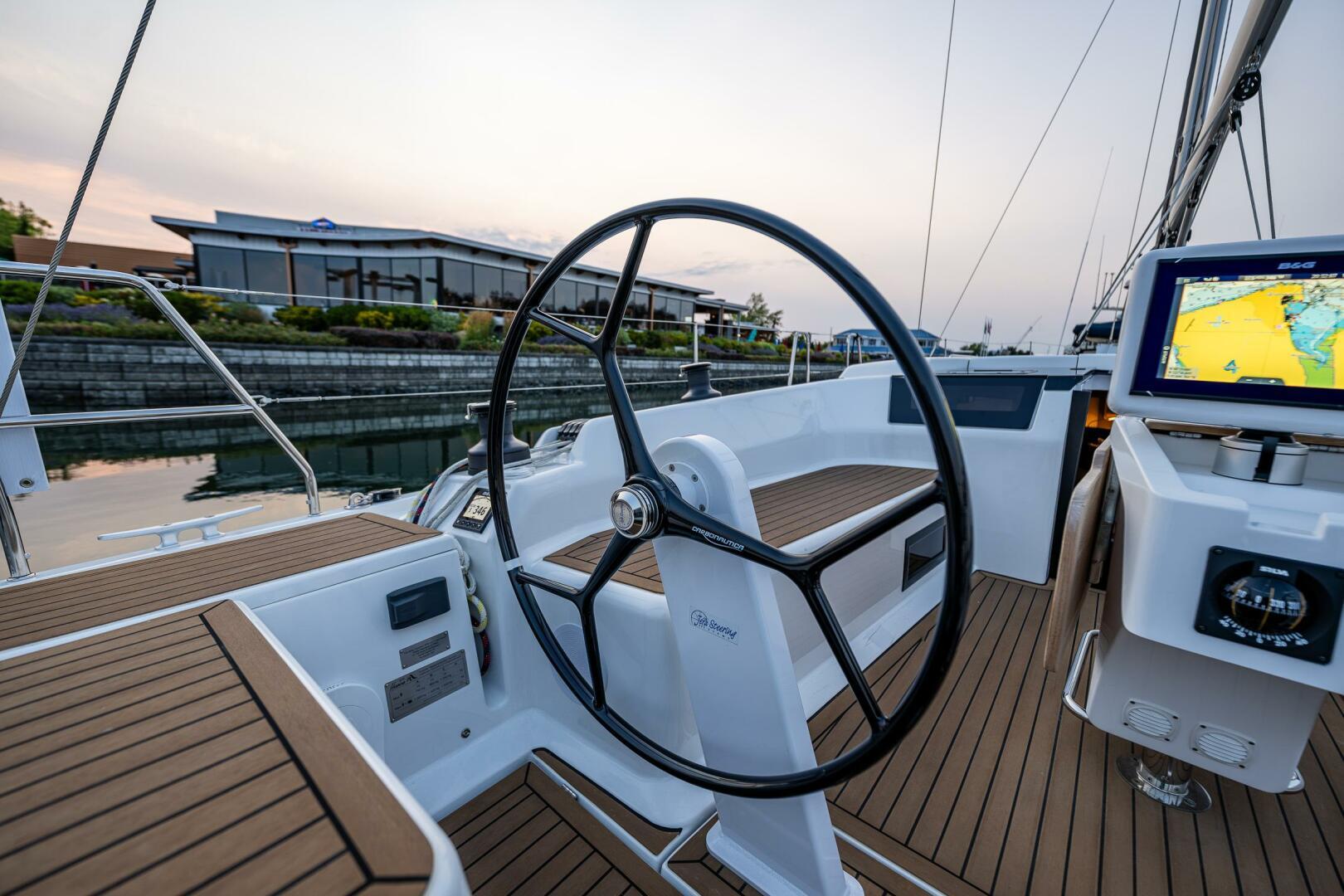Hanse-418 2023-SEA #304 IN STOCK WA-US-2023 Hanse 418 yacht cockpit with steering wheel and navigation system.-9568627 | Thumbnail