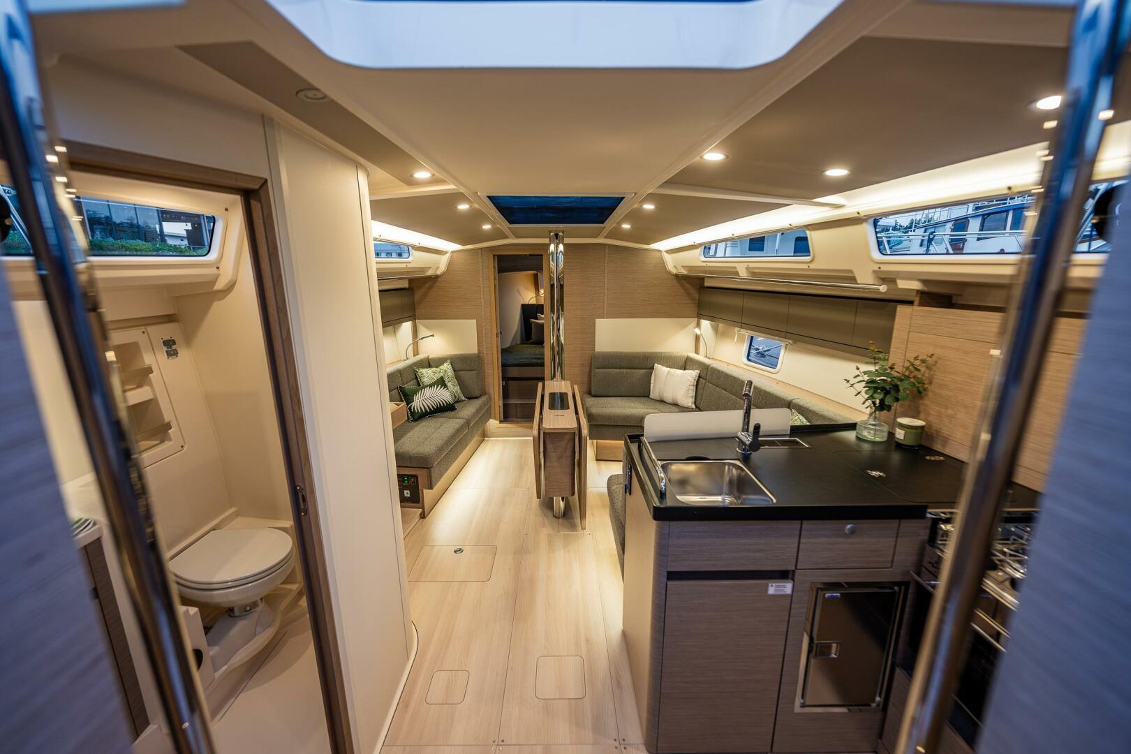 Hanse-418 2023-SEA #304 IN STOCK WA-US-Luxurious interior of 2023 Hanse 418 yacht with modern kitchen and seating area.-9568627 | Thumbnail