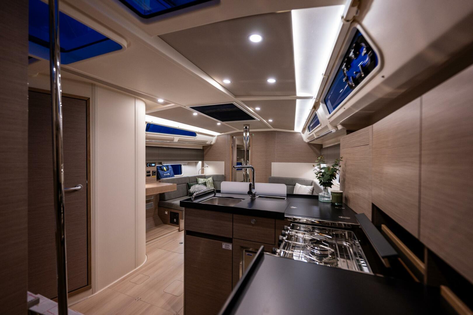 Hanse-418 2023-SEA #304 IN STOCK WA-US-Luxurious interior of 2023 Hanse 418 yacht with modern kitchen and seating area.-9568627 | Thumbnail