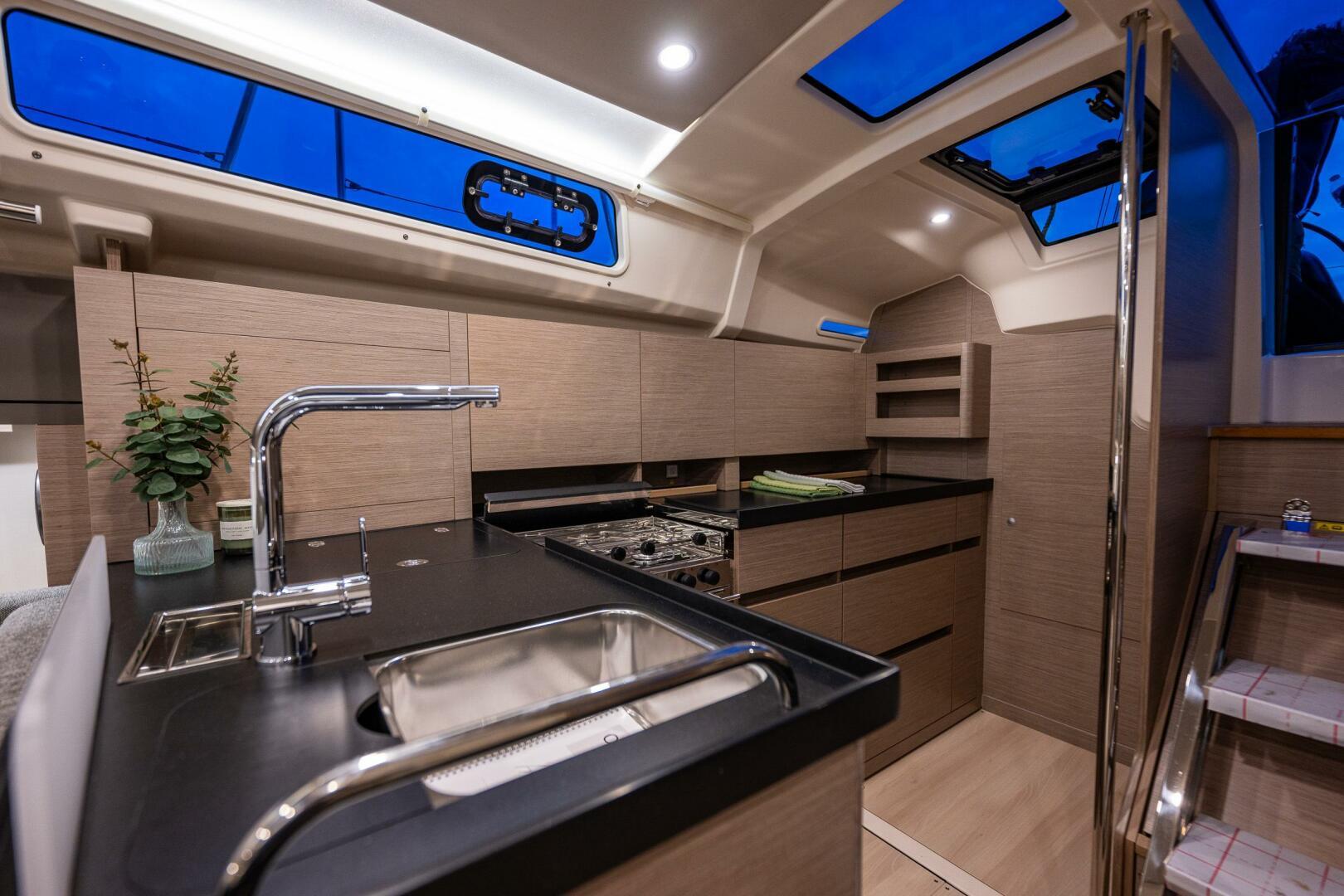 Hanse-418 2023-SEA #304 IN STOCK WA-US-Modern 2023 Hanse 418 yacht interior kitchen with sleek design and ample natural light.-9568627 | Thumbnail