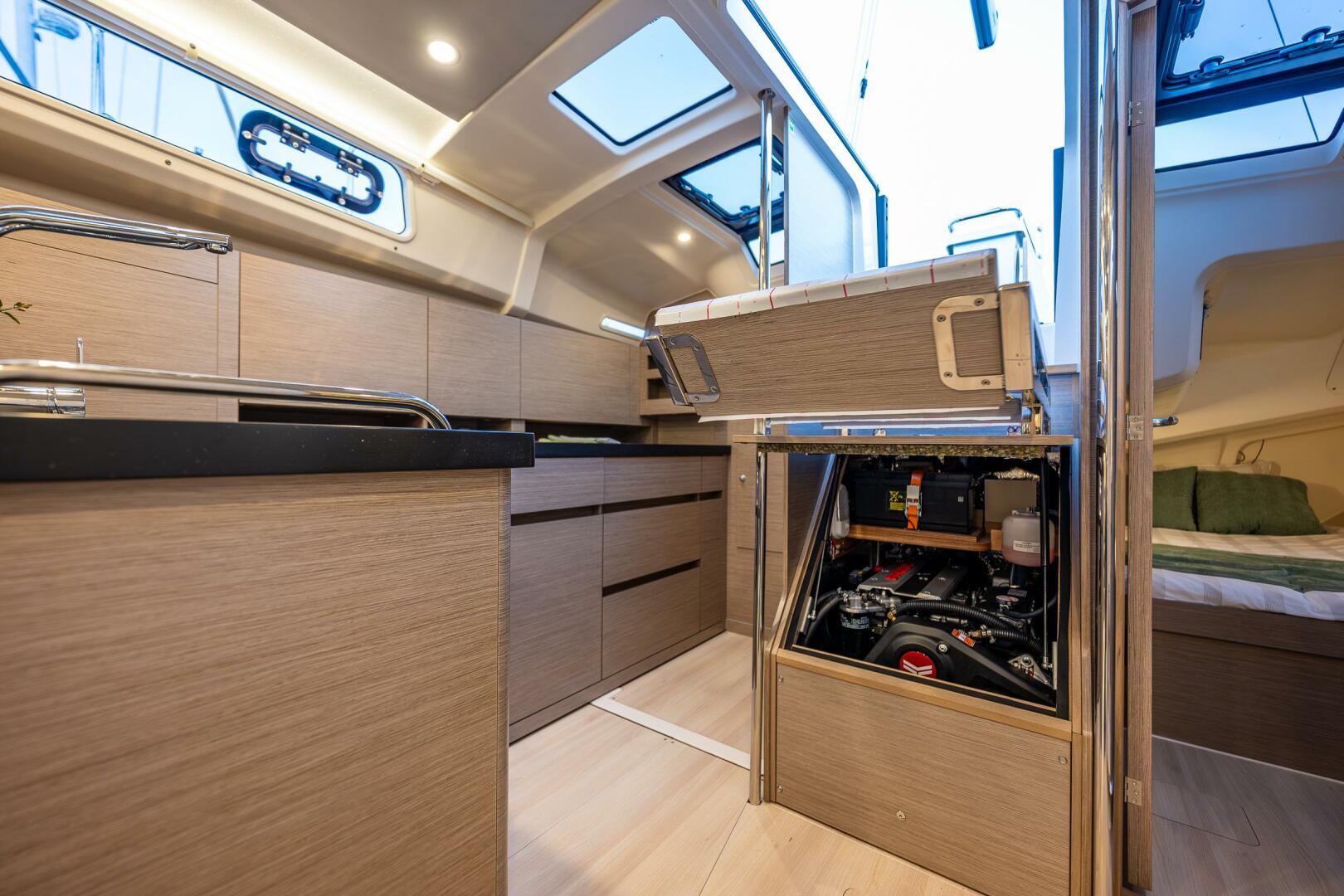 Hanse-418 2023-SEA #304 IN STOCK WA-US-Modern interior of 2023 Hanse 418 yacht with sleek cabinetry and engine access.-9568627 | Thumbnail