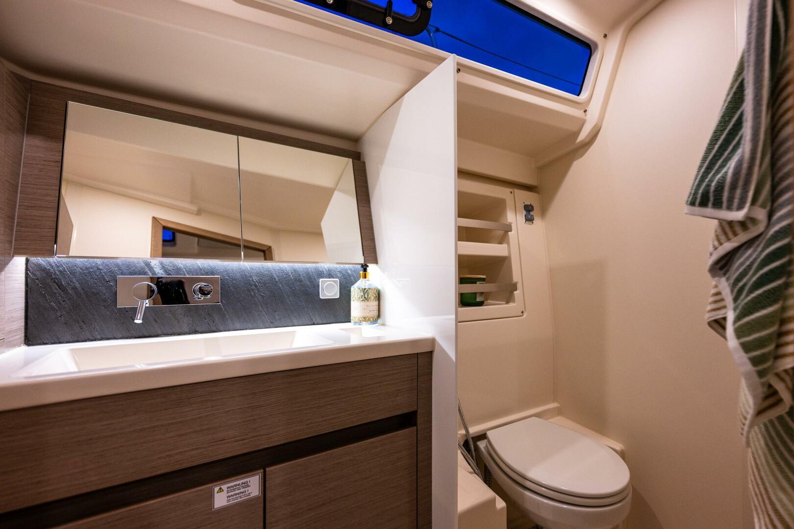 Hanse-418 2023-SEA #304 IN STOCK WA-US-Modern bathroom interior of 2023 Hanse 418 yacht with sleek fixtures and ample lighting.-9568627 | Thumbnail