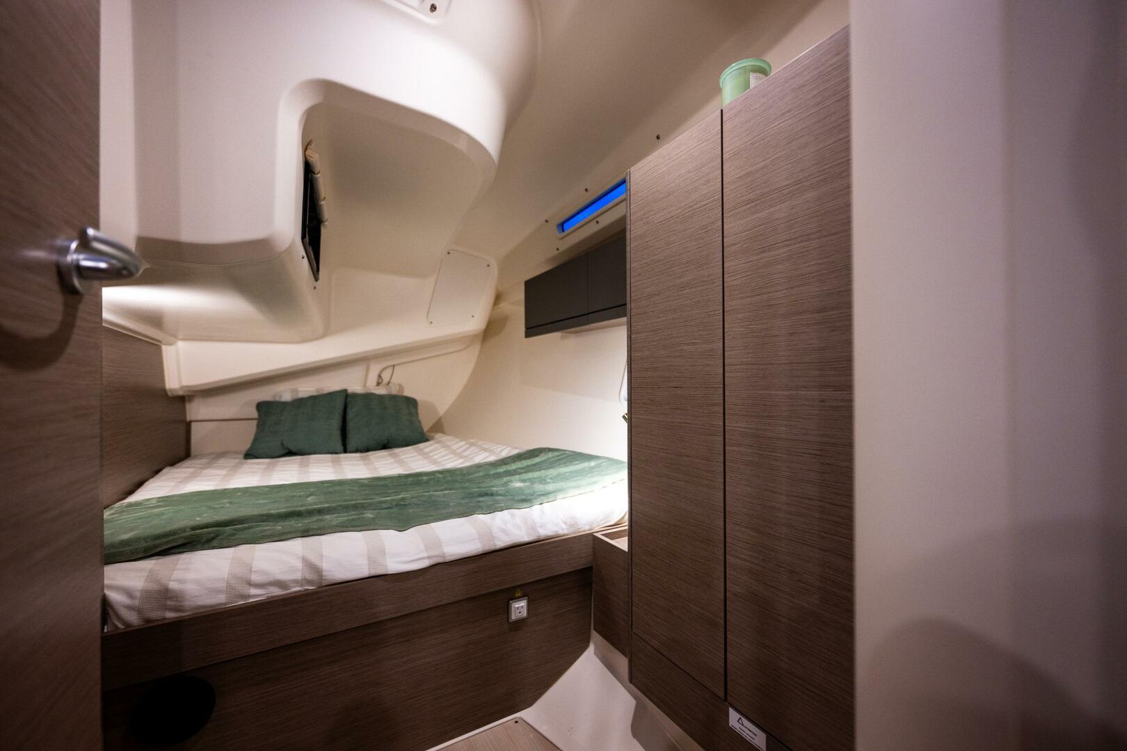 Hanse-418 2023-SEA #304 IN STOCK WA-US-Cozy cabin interior of 2023 Hanse 418 yacht with bed and wooden cabinetry.-9568627 | Thumbnail