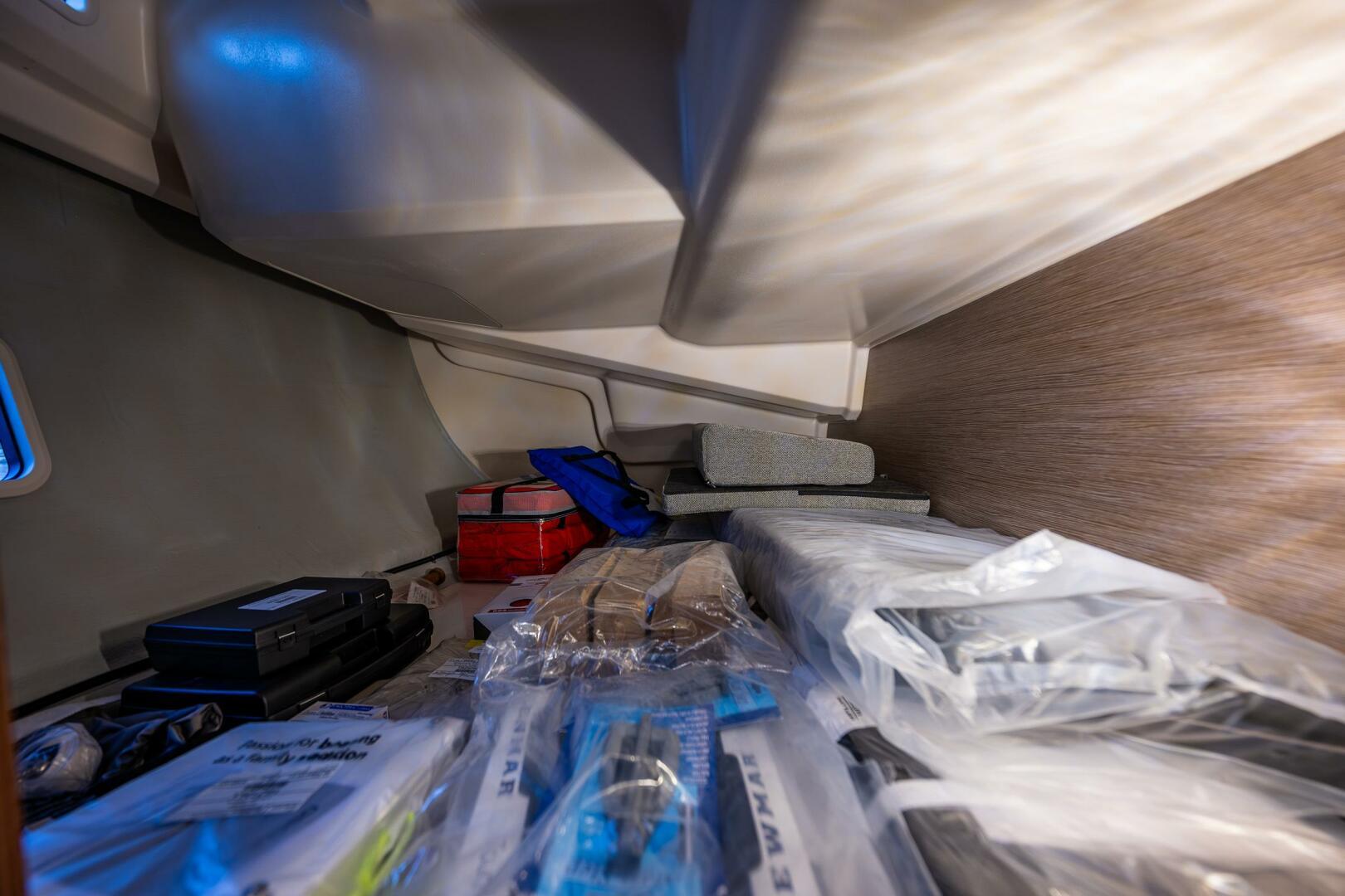 Hanse-418 2023-SEA #304 IN STOCK WA-US-Storage compartment in 2023 Hanse 418 yacht with various equipment and supplies.-9568627 | Thumbnail