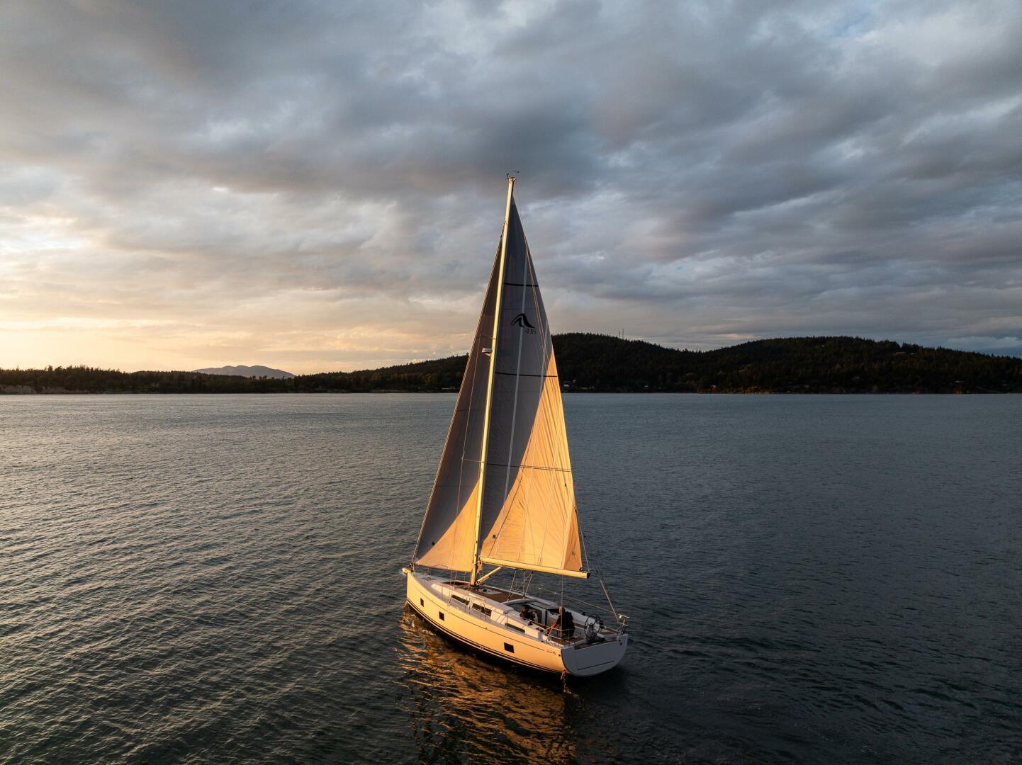 Hanse-418 2023-SEA #304 IN STOCK WA-US-Sailing yacht Hanse 418, 2023 model, gliding on serene waters at sunset.-9568627 | Thumbnail