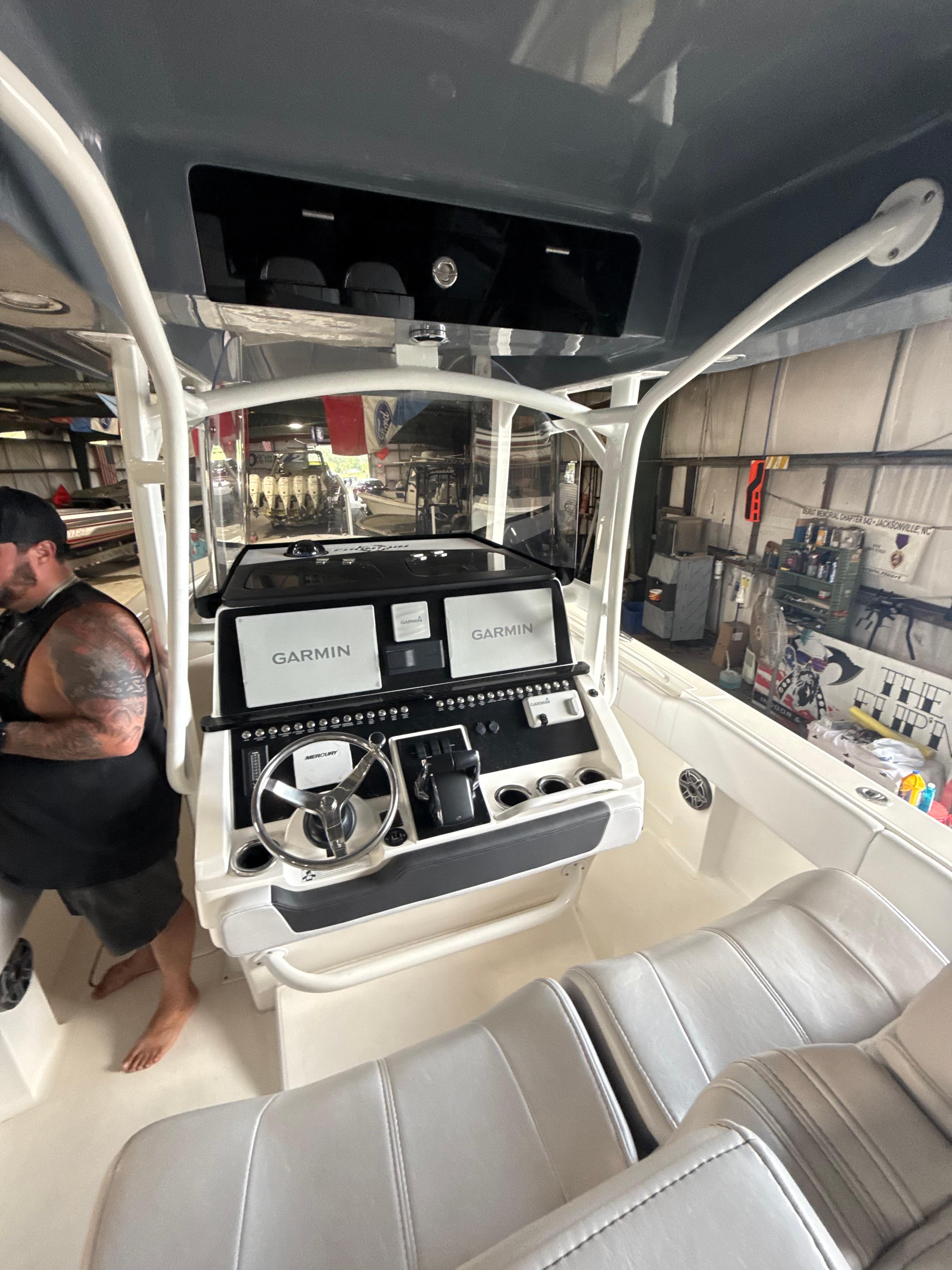 Fountain-34 CC 2023-FOUNTAIN 34 CC FL-US-2023 Fountain 34 CC boat interior with Garmin navigation system and seating.-9786946 | Thumbnail