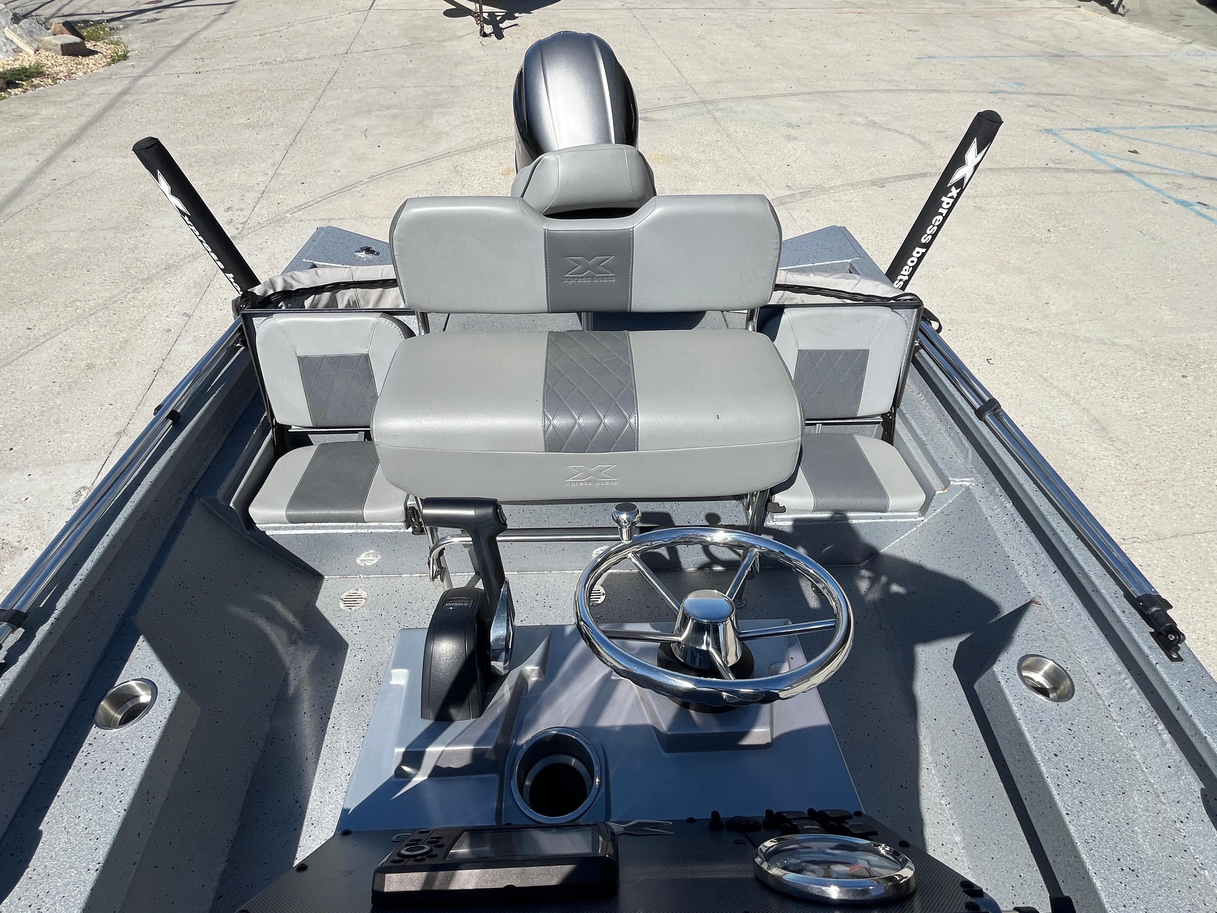 2022 Xpress H20B Bay Boat interior with steering wheel and seating.