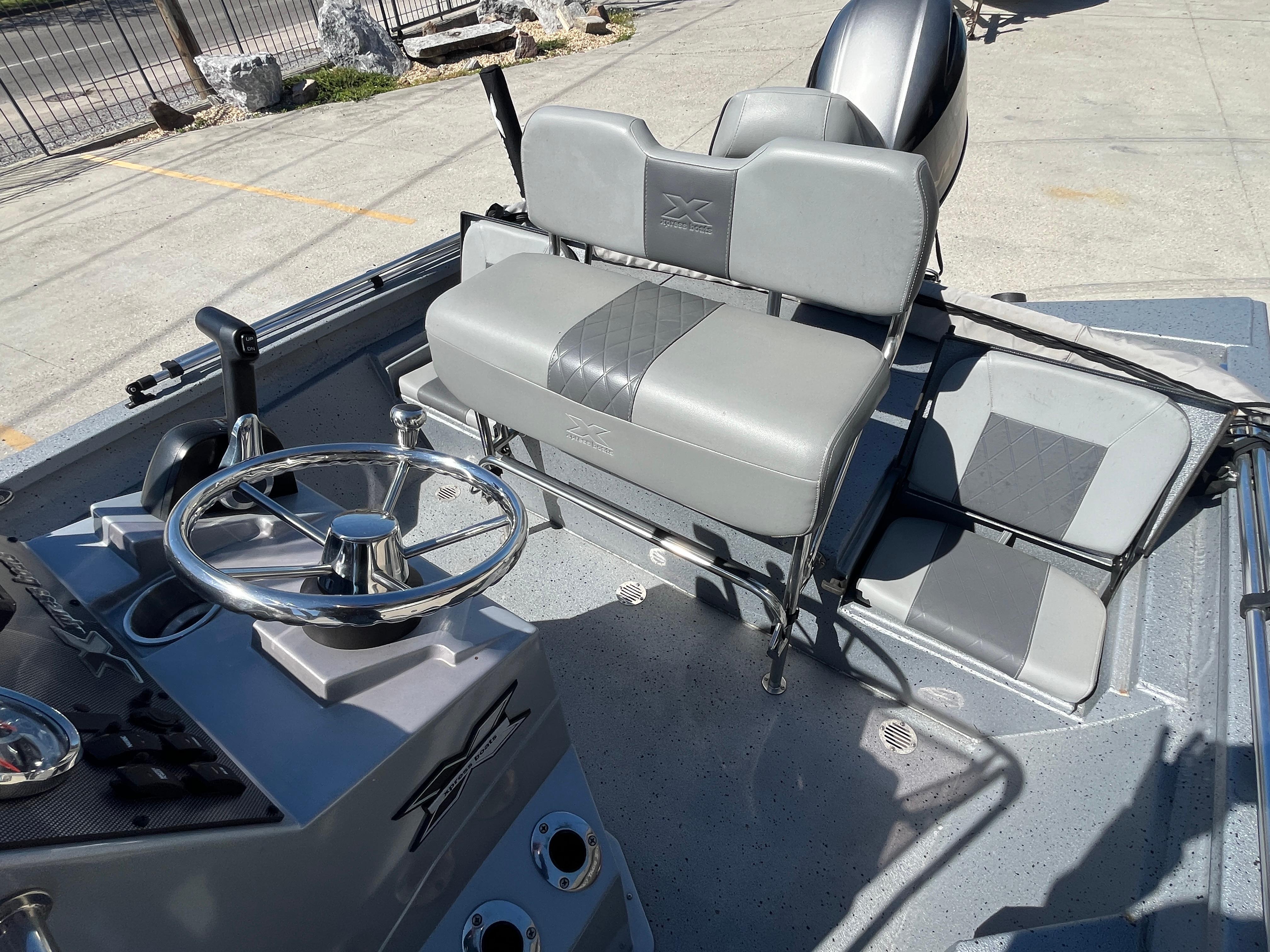 2022 Xpress H20B Bay Boat interior with steering wheel and seating.