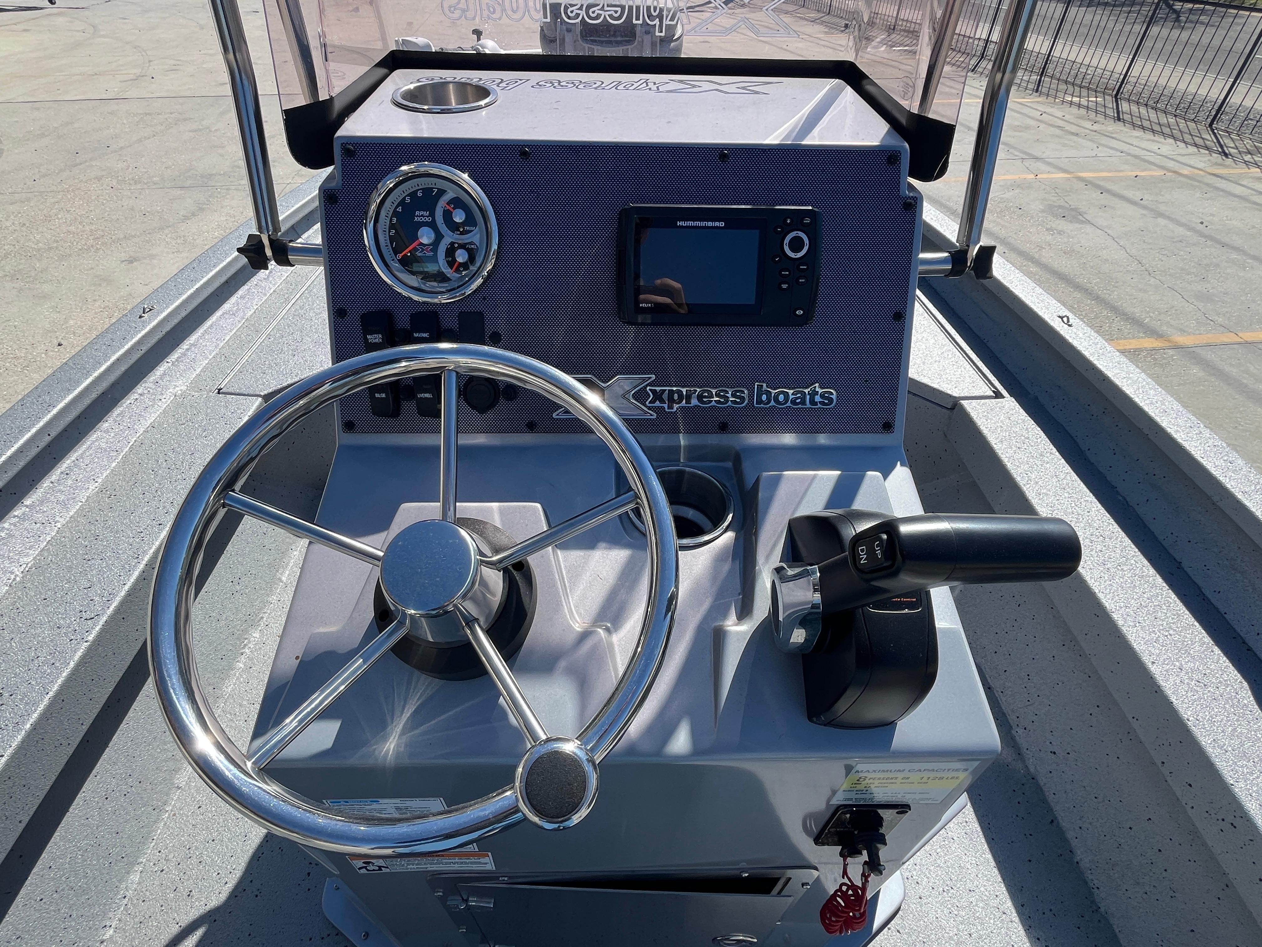 2022 Xpress H20B Bay Boat console with steering wheel and control panel.
