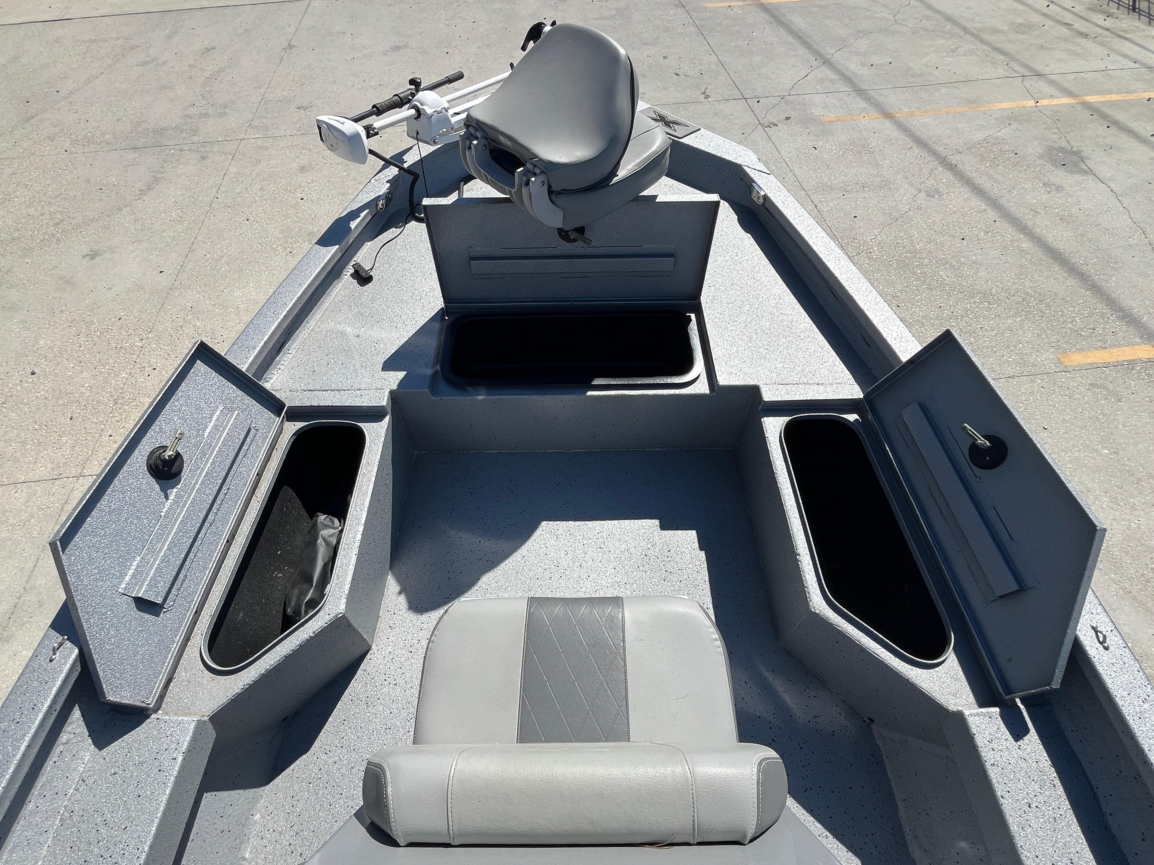 2022 Xpress H20B Bay Boat interior with open storage compartments and seating.