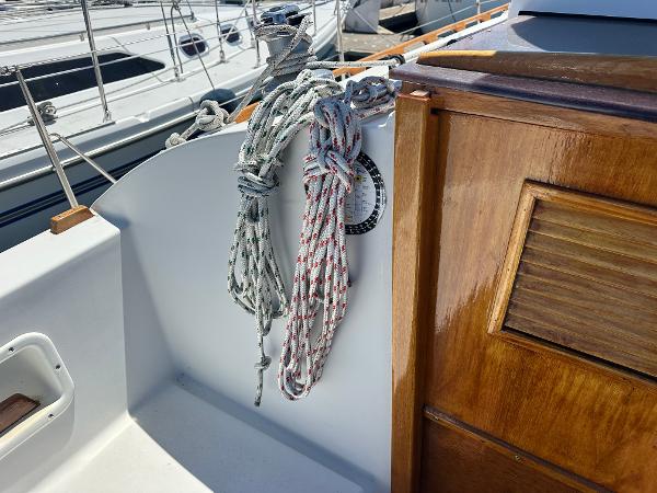 Ropes and wooden panel on 1986 Nonsuch Ultra sailboat deck.