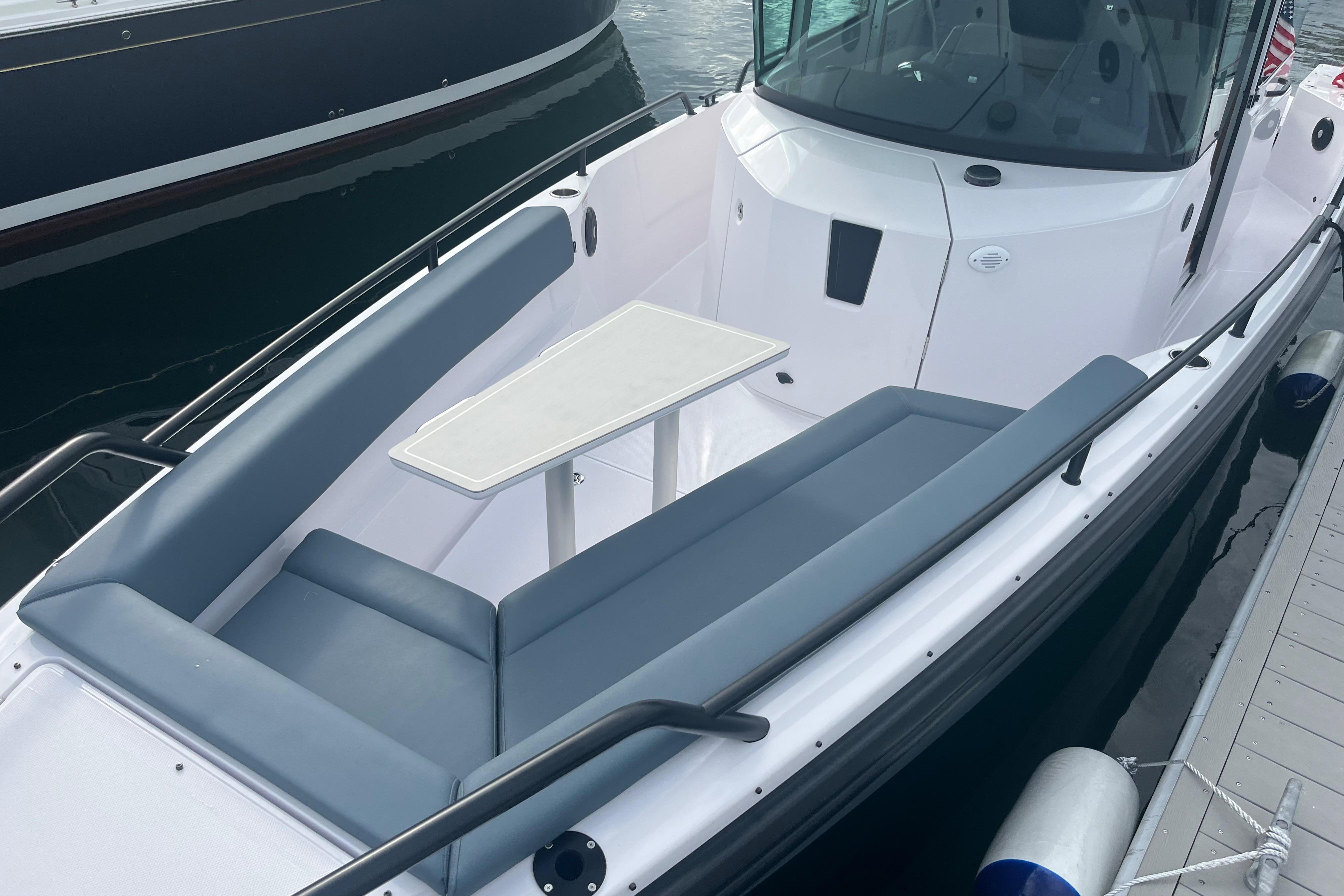 2022 Axopar 28 Cabin with Brabus Package, featuring sleek seating and a central table.