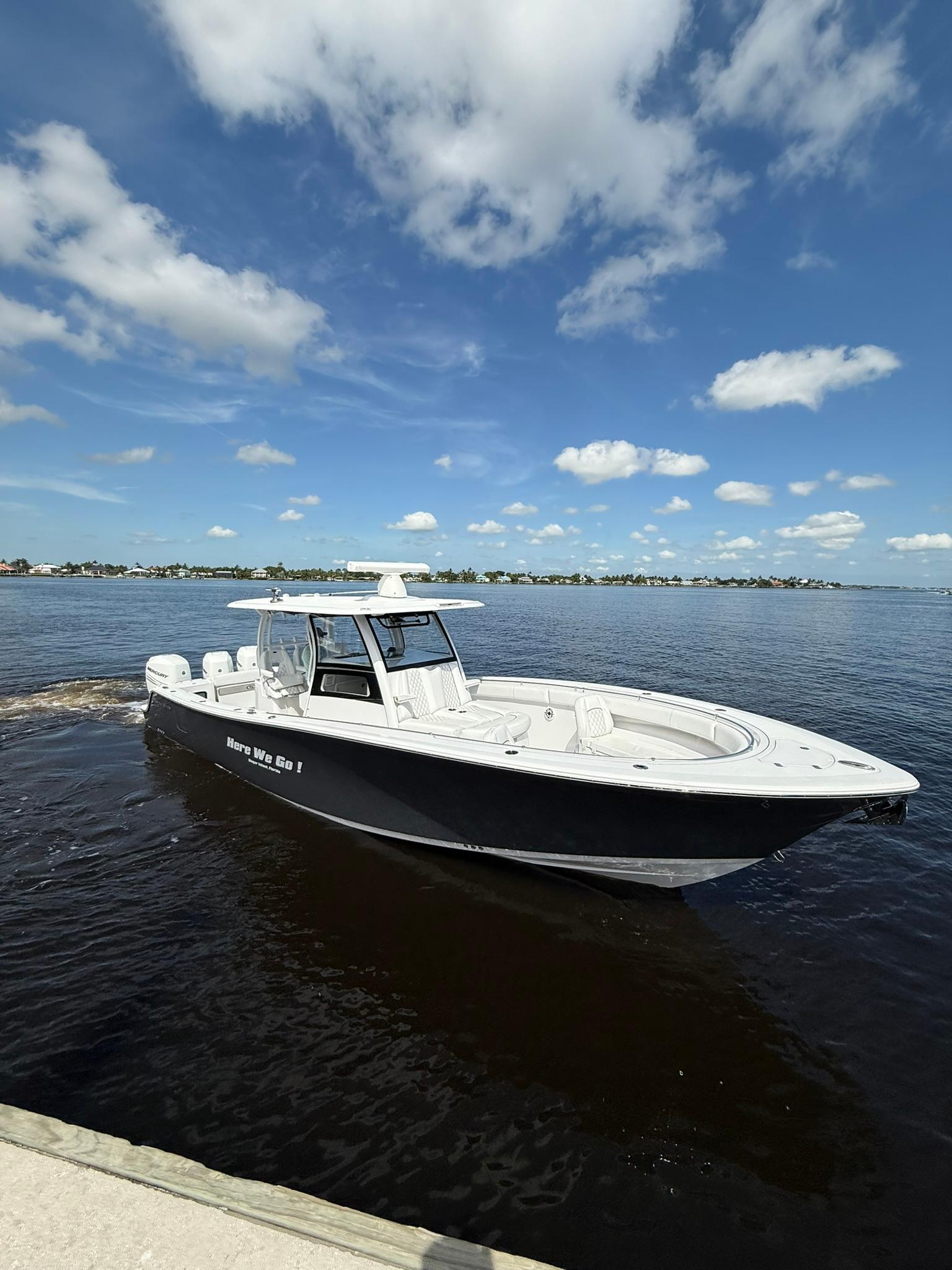 Sportsman-Open 352 Center Console 2021-Here We Go FL-US-2021 Sportsman Open 352 Center Console boat on calm water under a blue sky.-9850725